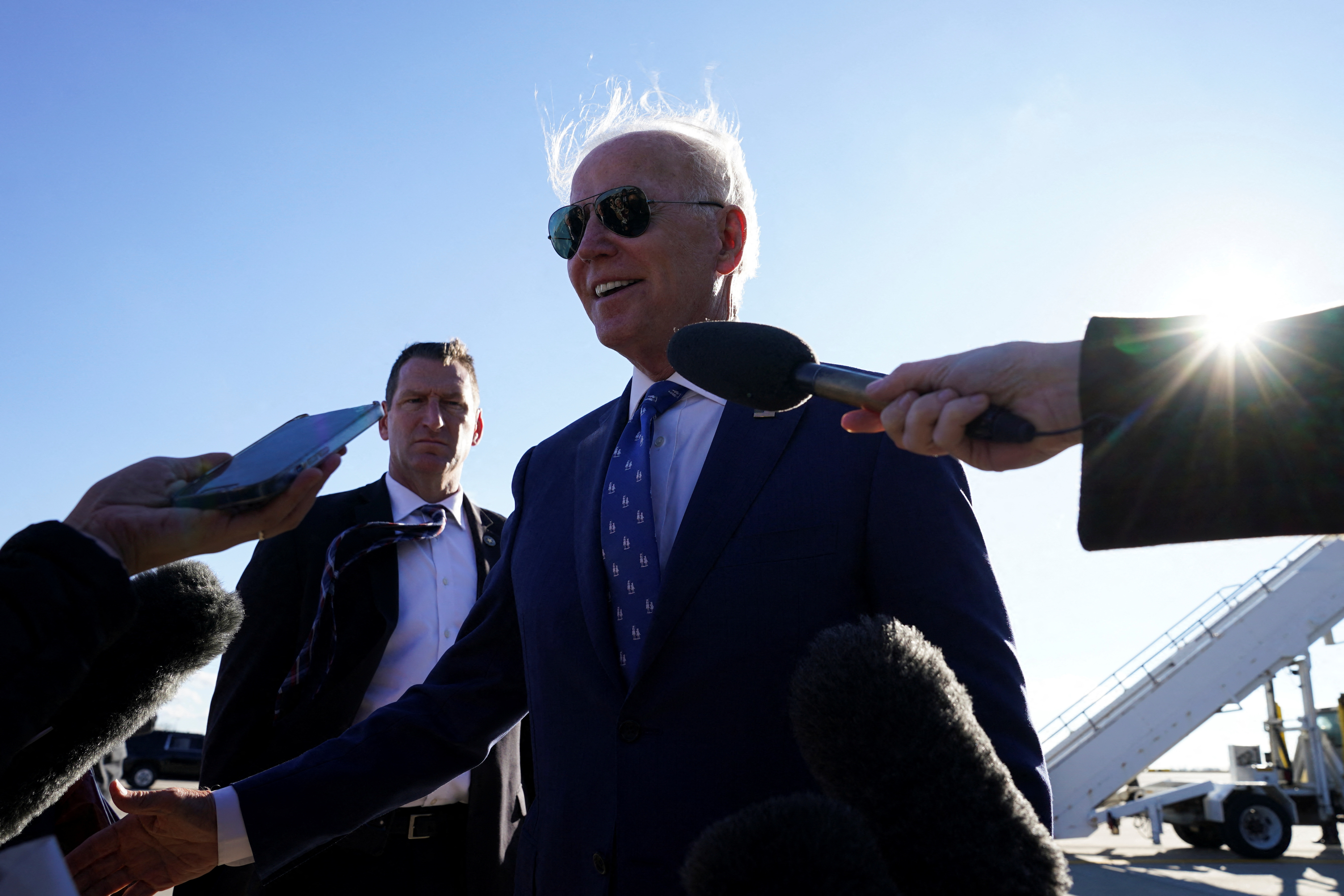 US President Joe Biden speaks to members of the media, following an event touting economic and infrastructure spending plans, as he departs, at the Cincinnati/Northern Kentucky International Airport, in Hebron, Kentucky, US, January 4, 2023. REUTERS/Kevin Lamarque