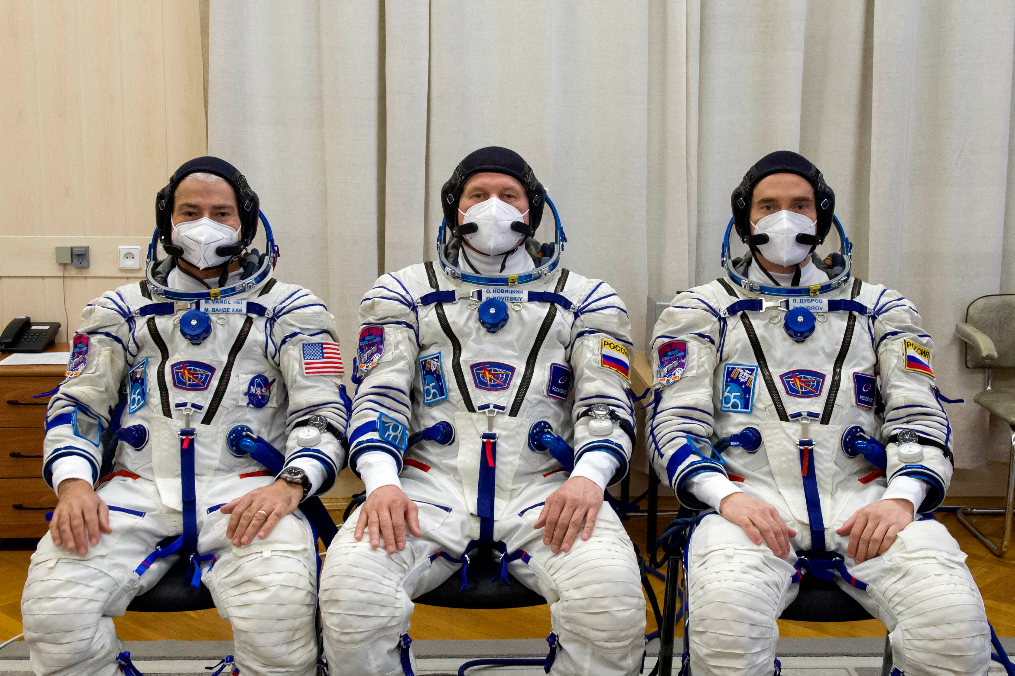 File photo: International Space Station (ISS) crew members NASA's Mark Vande Hai, astronauts Oleg Novitsky and Roscosmos' Pyotr Dubrov during a space suit test on the Bikaner Cosmotrome.  Irina Specter via REUTERS / GCTC / Roscosmos / Guide