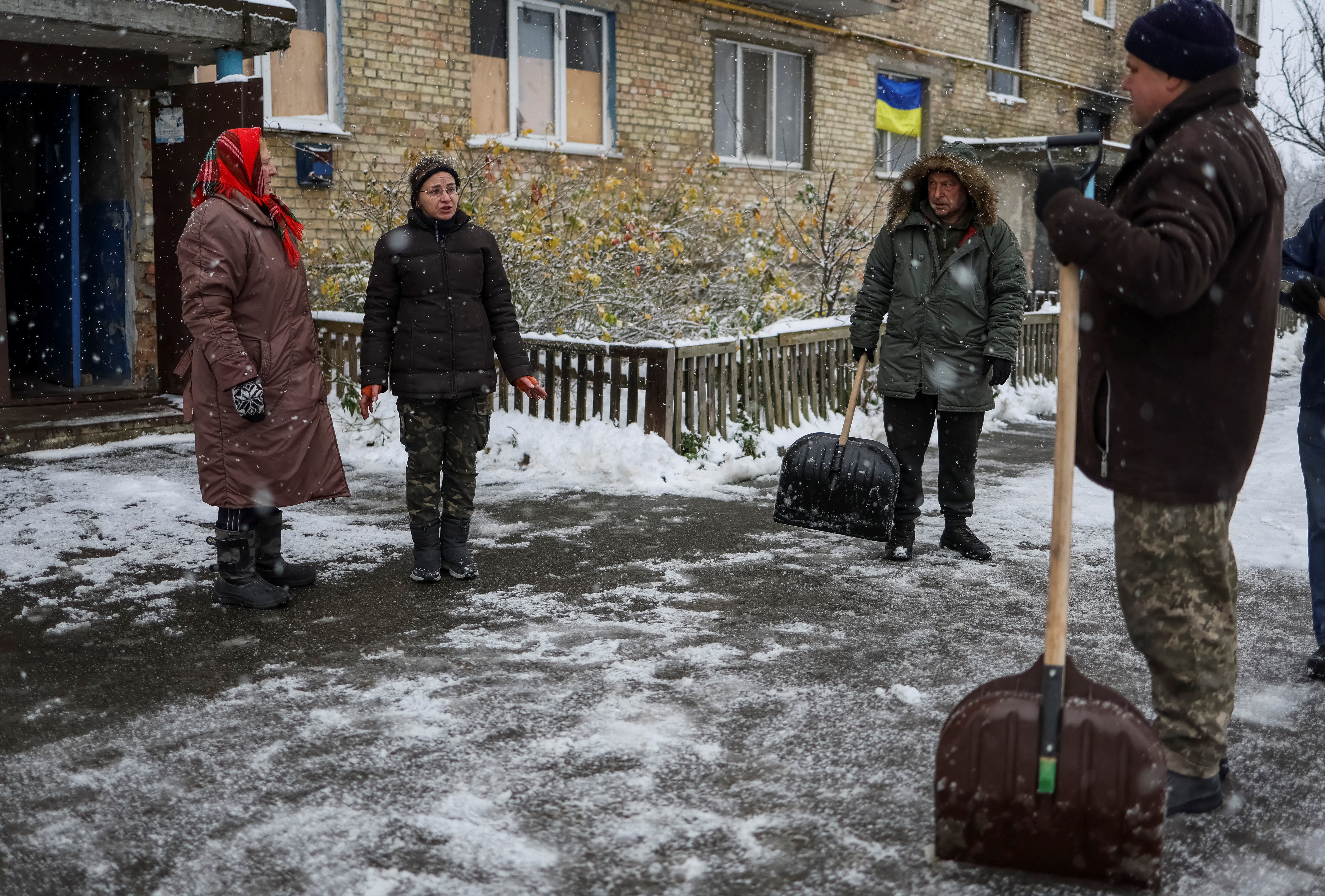 Residents of Horenka, destroyed by shelling and without electricity (Reuters)