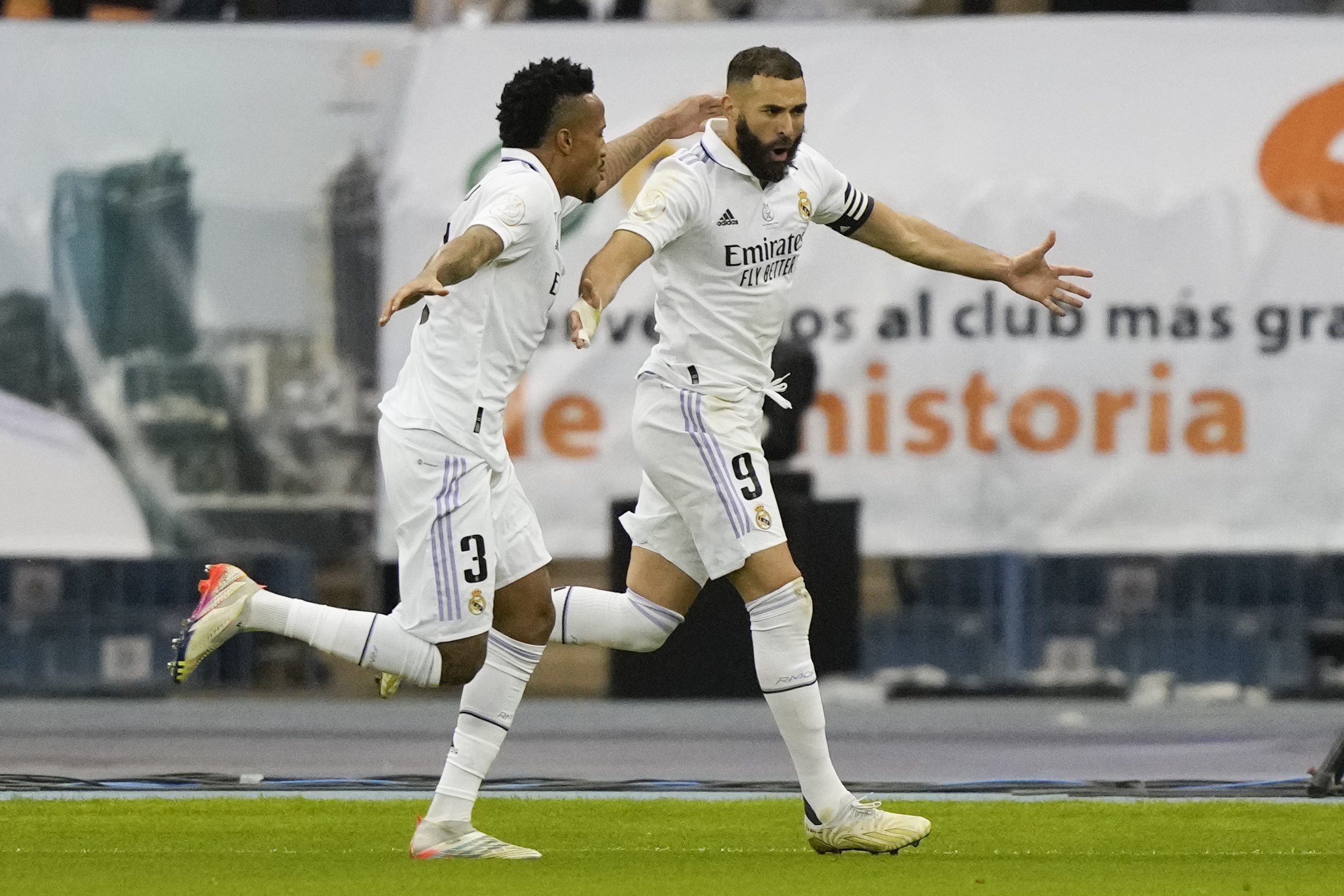 In this Wednesday, January 11, 2023 photo, Real Madrid's Eder Militao and Karim Benzema celebrate after scoring a goal in the Spanish Super Cup semi-final against Valencia in Riyadh, Saudi Arabia.  (AP Photo/Hussein Malla)