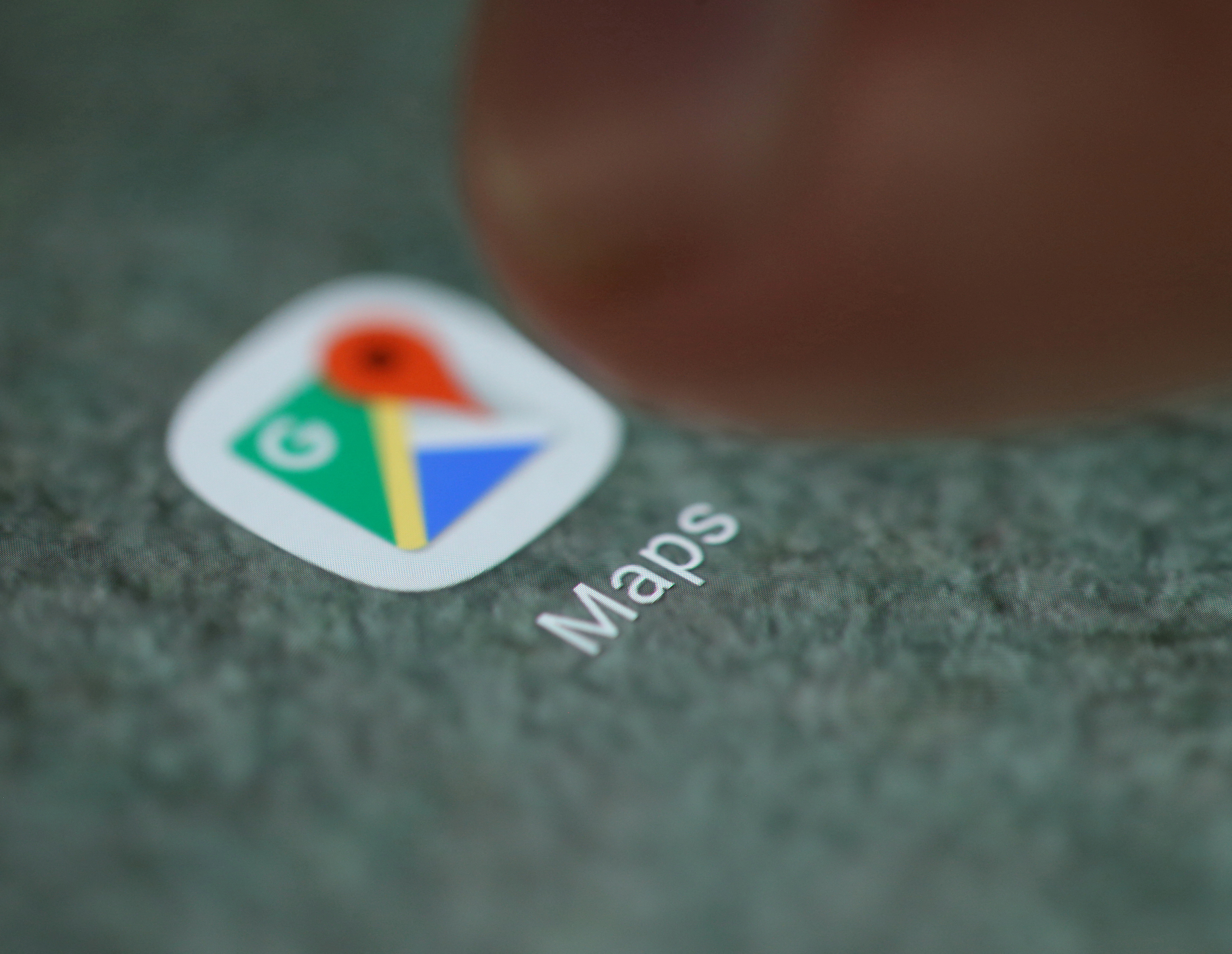FILE PHOTO: The Google Maps app logo is seen on a smartphone in this picture illustration taken September 15, 2017. REUTERS/Dado Ruvic/Illustration/File Photo