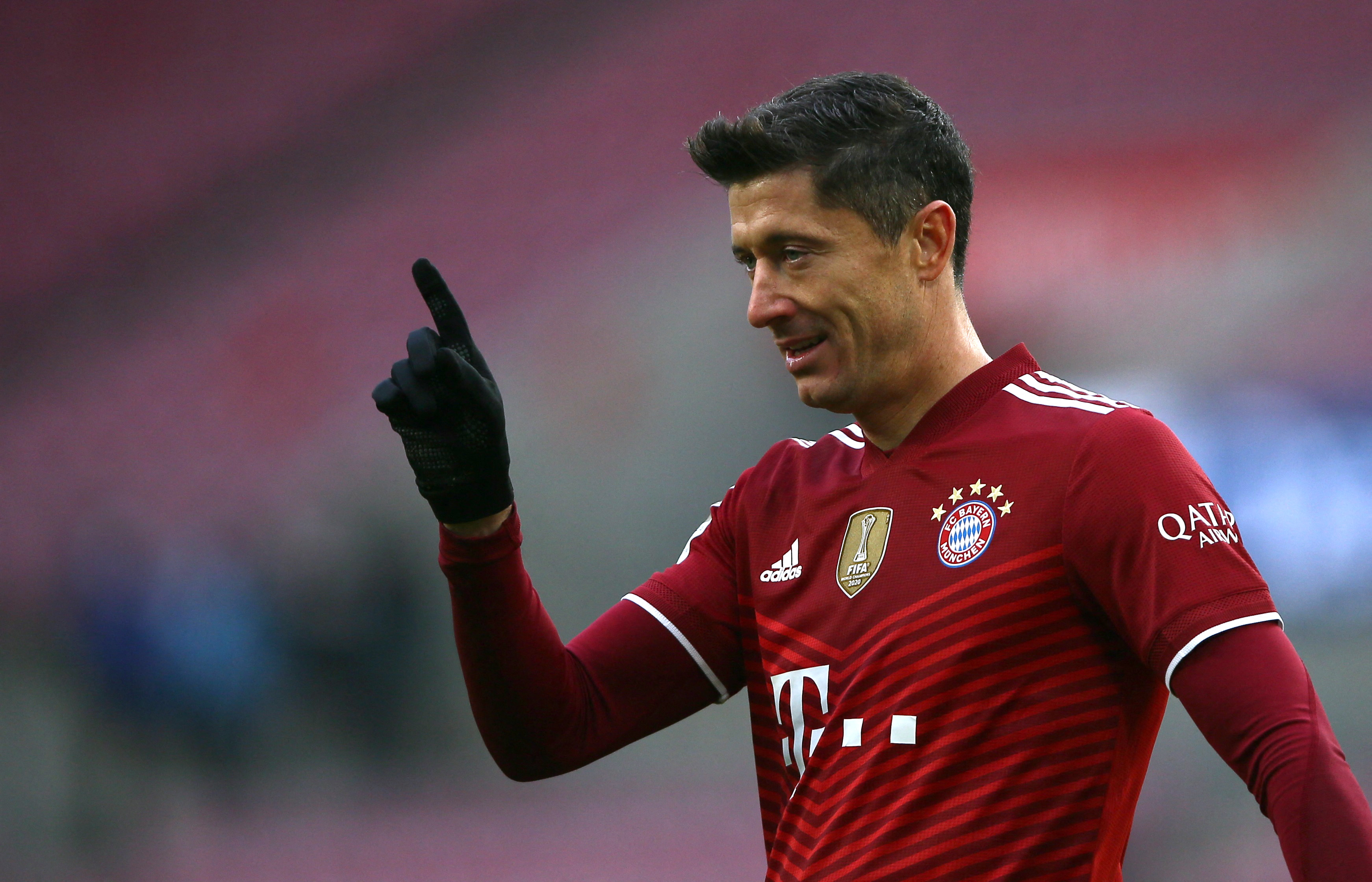 Soccer Football - Bundesliga - FC Cologne v Bayern Munich - RheinEnergieStadion, Cologne, Germany - January 15, 2022 Bayern Munich's Robert Lewandowski gestures as he scores their first goal that is later awarded after a VAR review REUTERS/Thilo Schmuelgen DFL REGULATIONS PROHIBIT ANY USE OF PHOTOGRAPHS AS IMAGE SEQUENCES AND/OR QUASI-VIDEO.