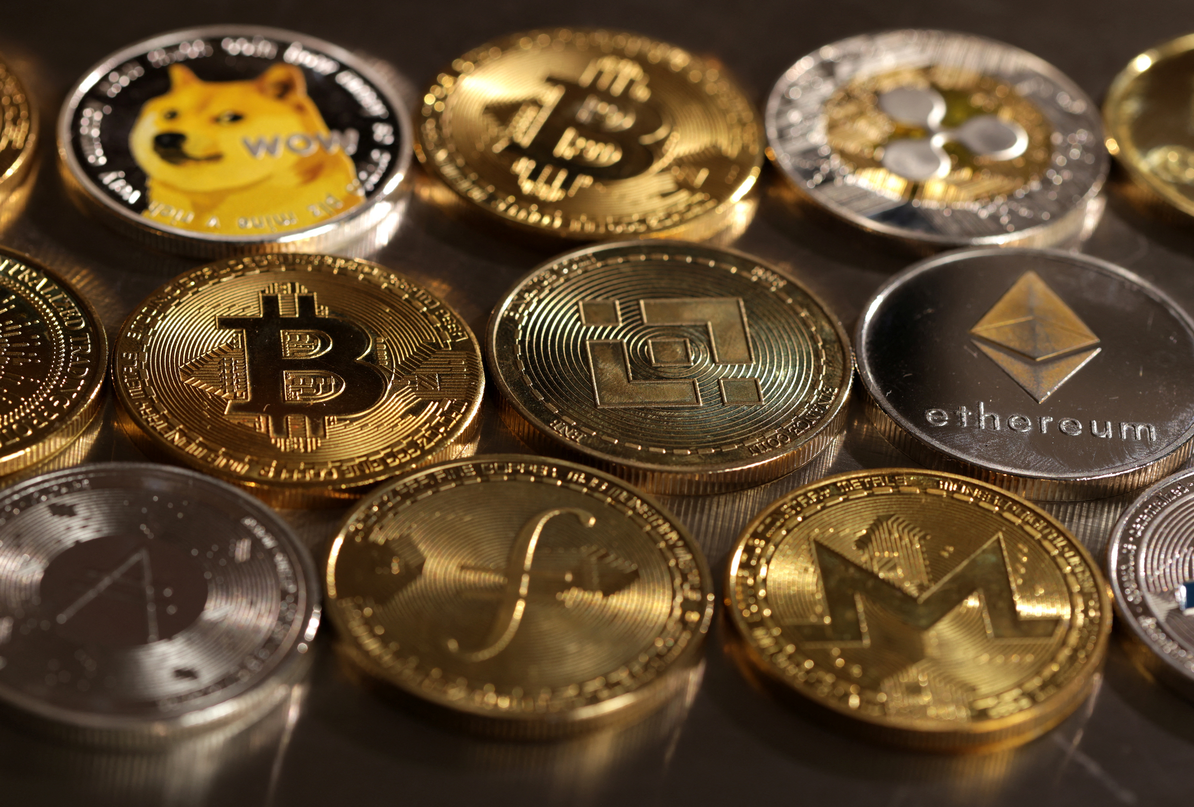 Representations of various cryptocurrencies.  (REUTERS/Dado Ruvic/Illustration)