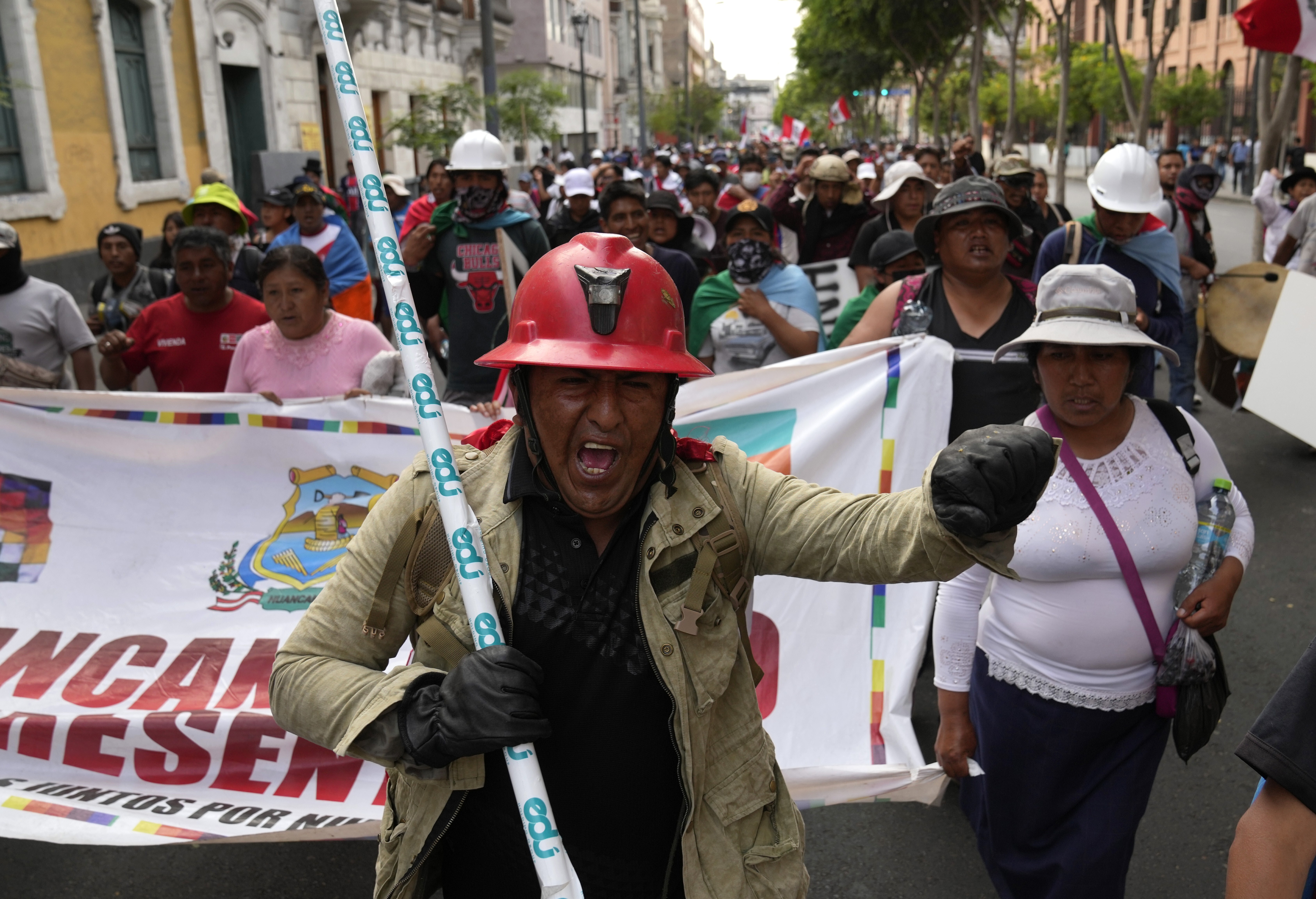 Anti-government protesters march through Lima, Peru, Wednesday, Feb. 1, 2023. (AP Photo/Martin Mejia)