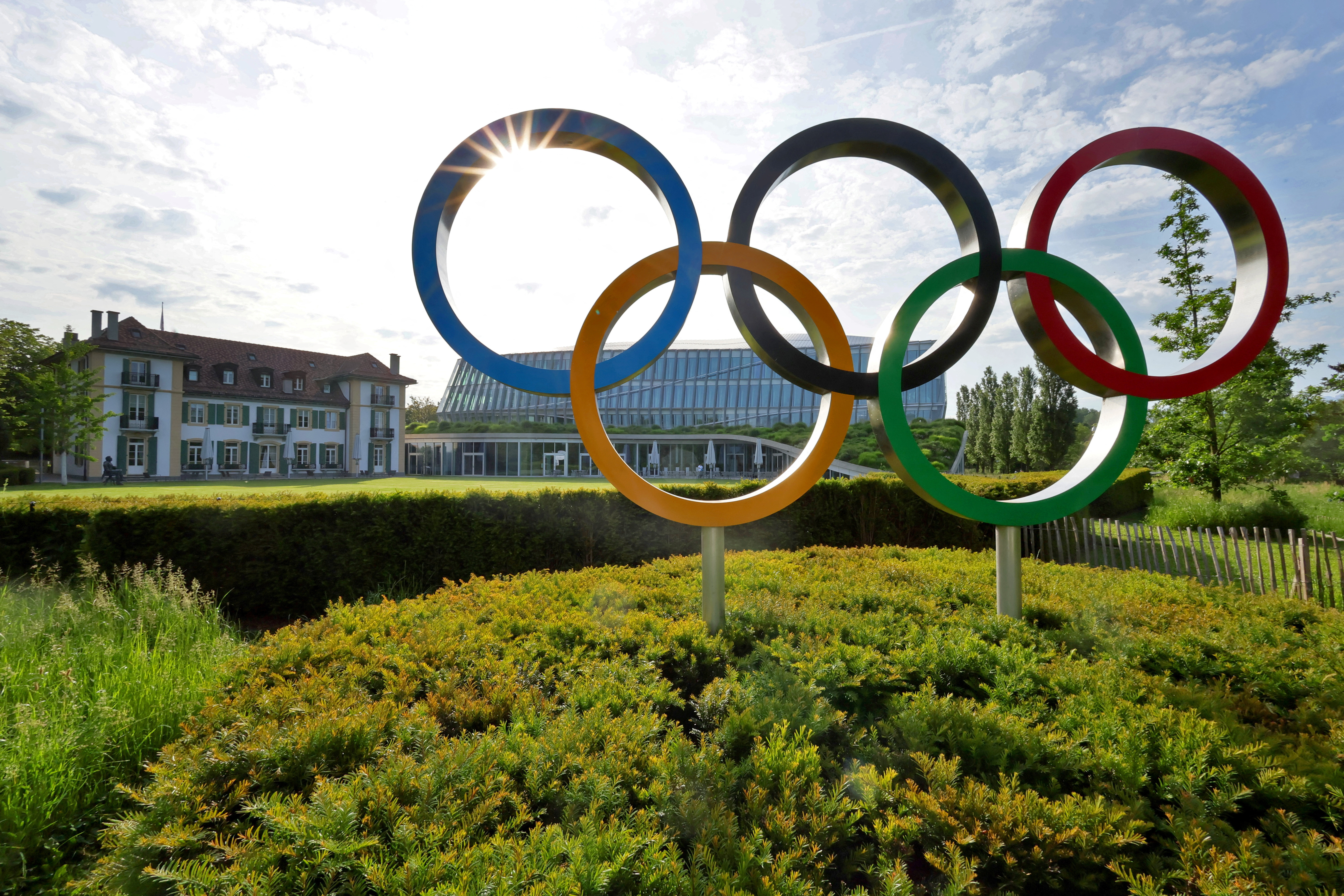 FILE PHOTO: The Olympic rings are pictured in front of the International Olympic Committee (IOC) headquarters in Lausanne, Switzerland, May 17, 2022. REUTERS/Denis Balibouse/File Photo