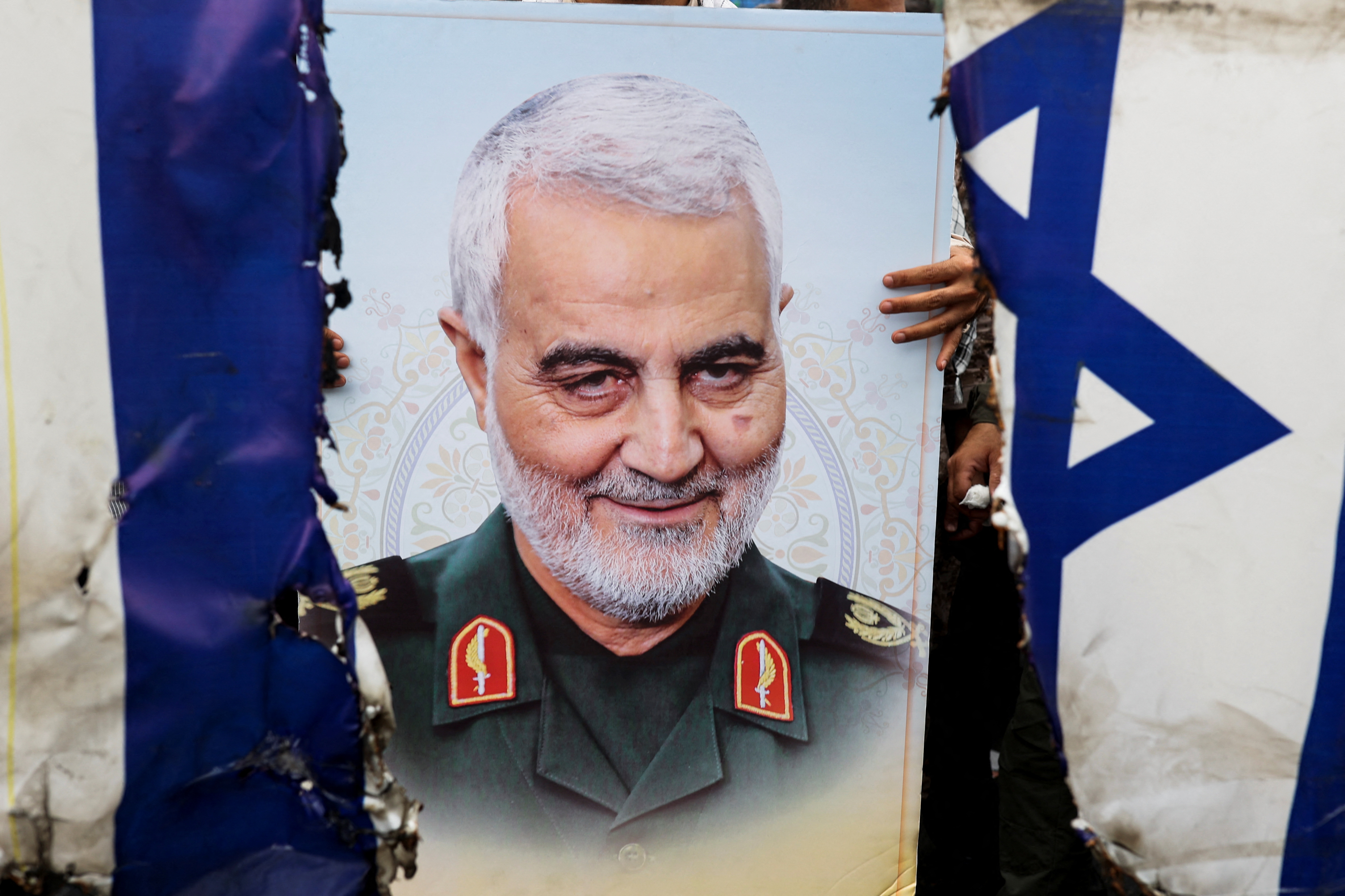 Un cartel del alto comandante militar iraní, el general Qassem Soleimani. (Majid Asgaripour/WANA via REUTERS)