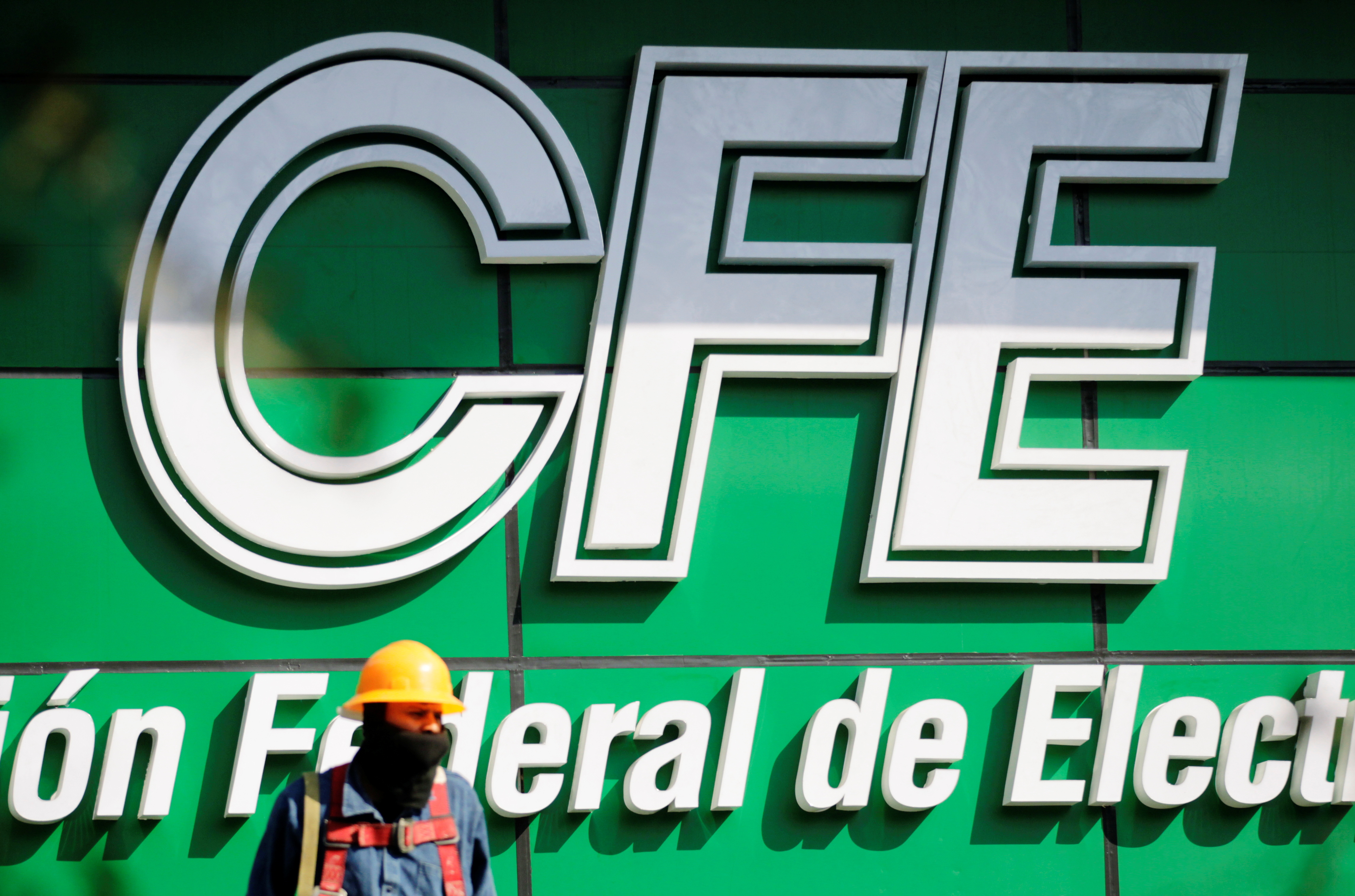 The logo of Mexico's state-run electric utility known as the Federal Electricity Commission (CFE), is pictured at its building office in Monterrey, Mexico February 9, 2021. REUTERS/Daniel Becerril