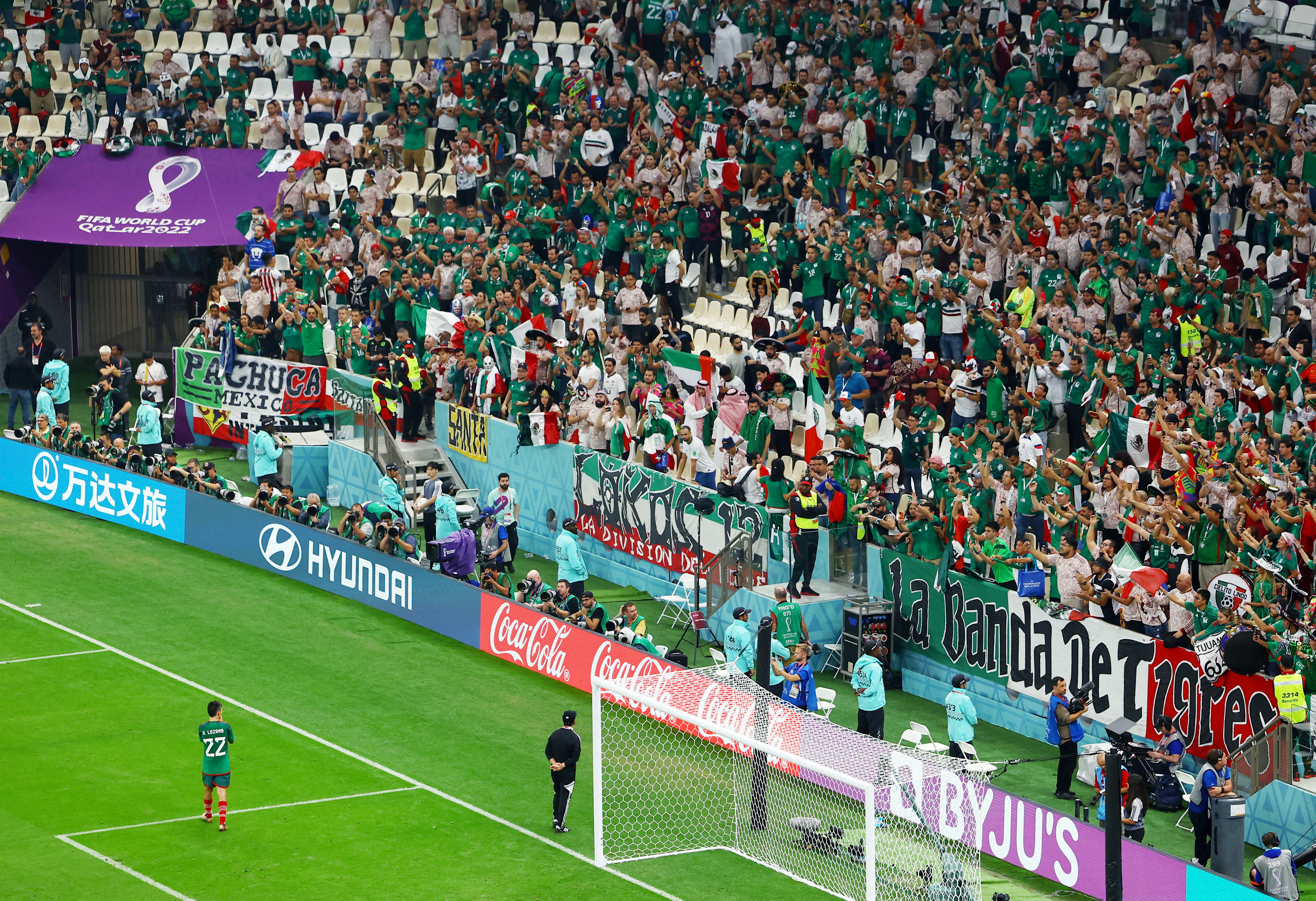 Soccer Football - FIFA World Cup Qatar 2022 - Group C - Saudi Arabia v Mexico - Lusail Stadium, Lusail, Qatar - December 1, 2022 Mexico's Hirving Lozano applauds fans after the match as Mexico are eliminated from the World Cup REUTERS/Molly Darlington