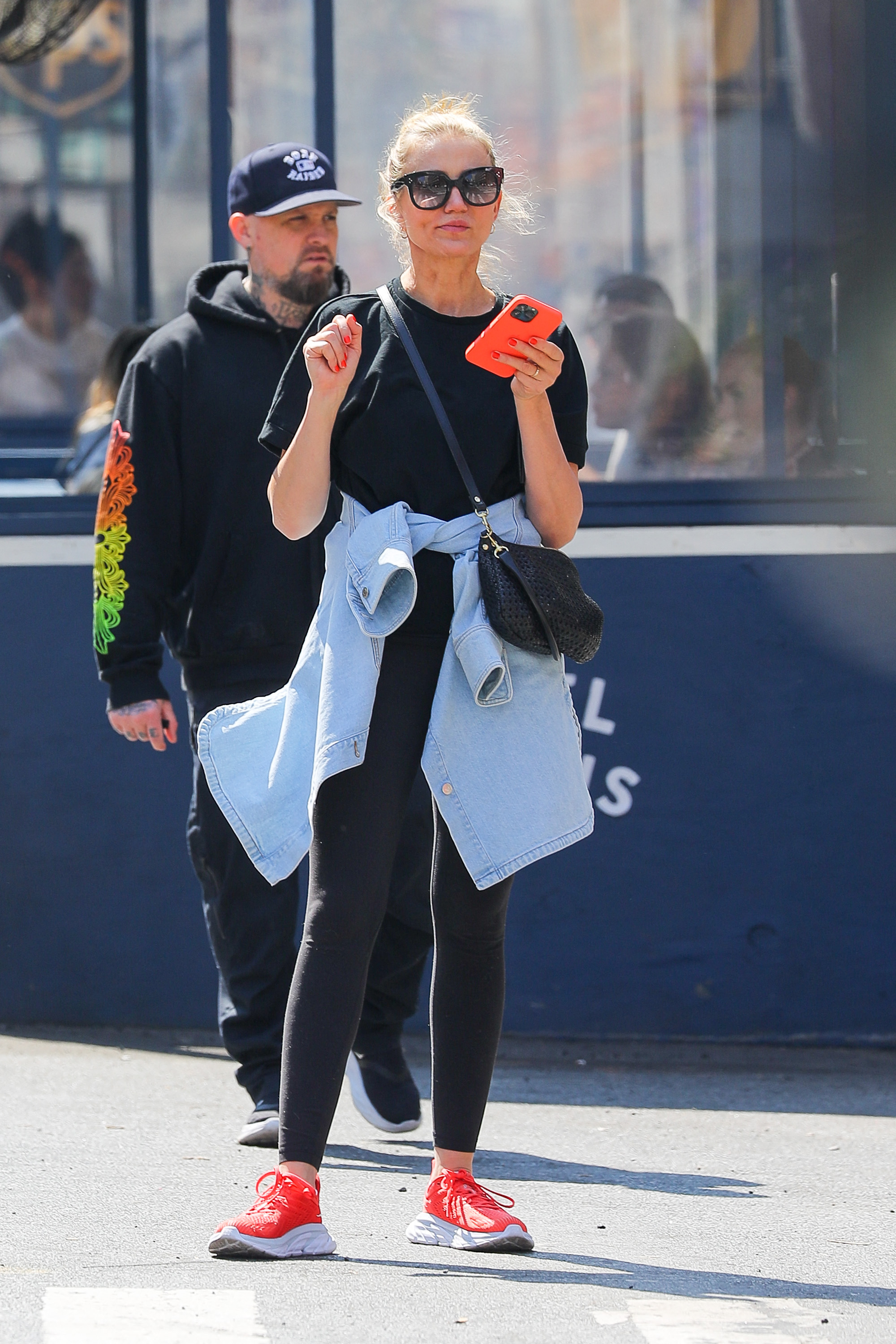 Cameron Diaz and Benji Madden were caught walking the streets of New York in a super sporty look: black tights and sneakers