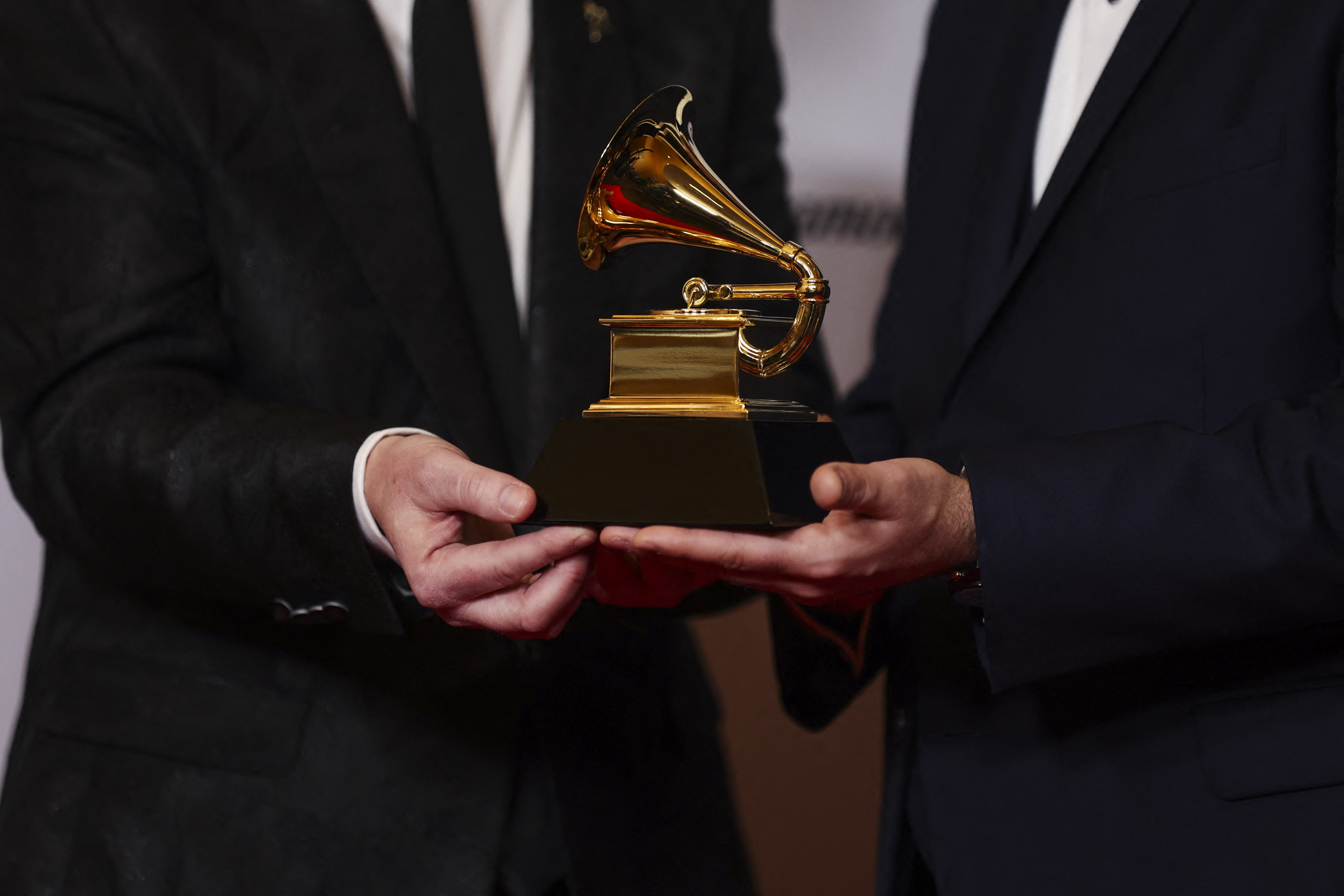 Michael Romanowski and Charlie Post pose with the Grammy for Best Classical Engineered Album for "Bates: Philharmonia Fantastique - The Making Of The Orchestra" during the Premiere Ceremony of the 65th Annual Grammy Awards in Los Angeles, California, U.S., February 5, 2023. REUTERS/Mike Blake