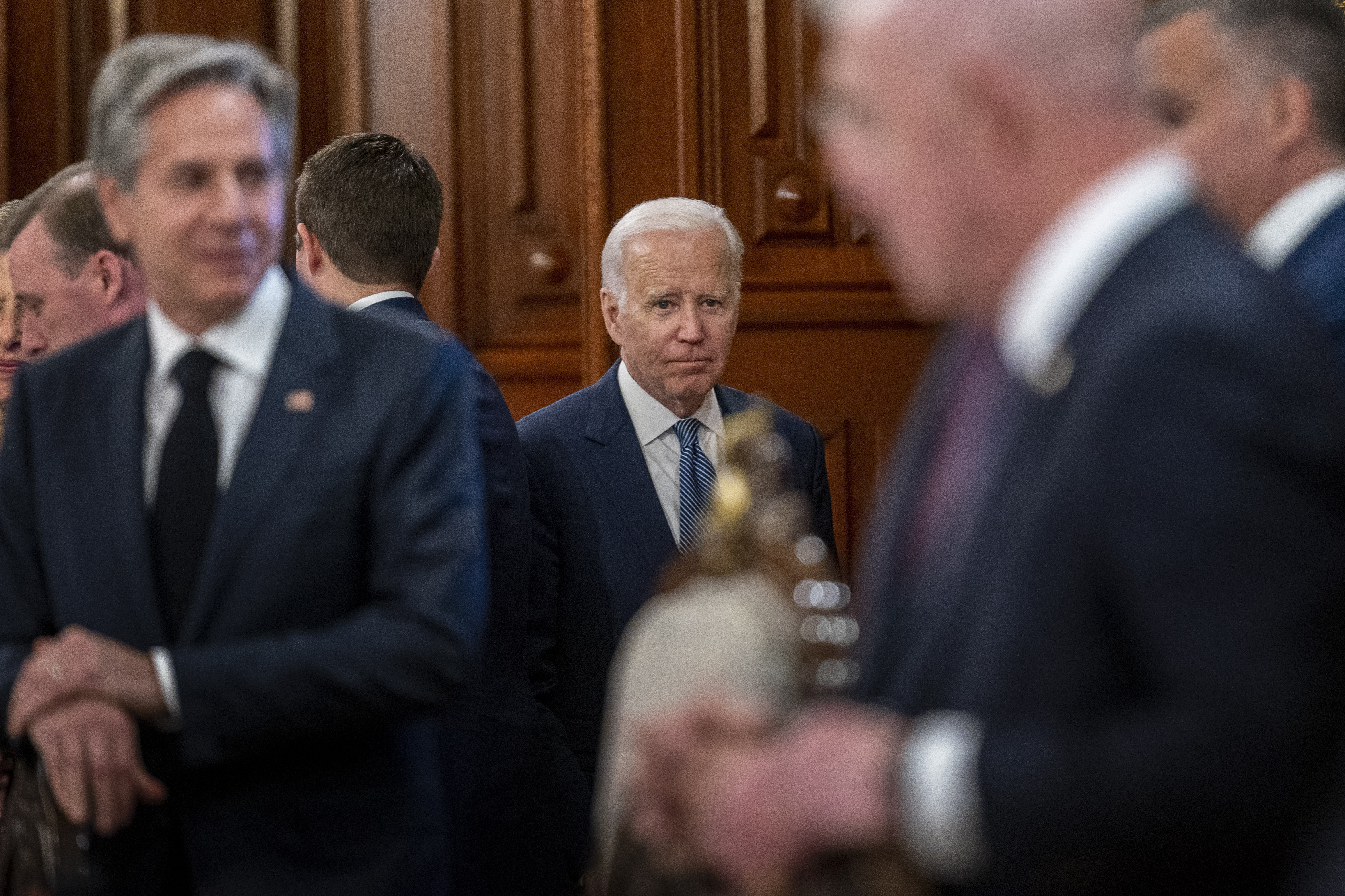 US President Joe Biden, center, accompanied by US Secretary of State Antony Blinken, left, arrives for a meeting with Mexican President Andrés Manuel López Obrador at the National Palace of Mexico City, in Mexico City, Monday, Jan. 9, 2023. (AP Photo/Andrew Harnik)