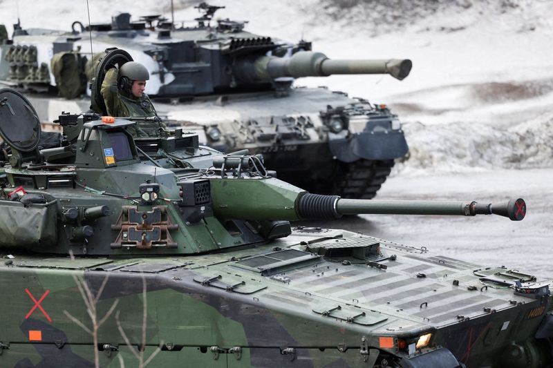 Swedish and Finnish tanks during a military exercise called "Cold Response 2022", which brought together some 30,000 soldiers from NATO member countries plus Finland and Sweden in Evenes, Norway.  REUTERS/Yves Herman