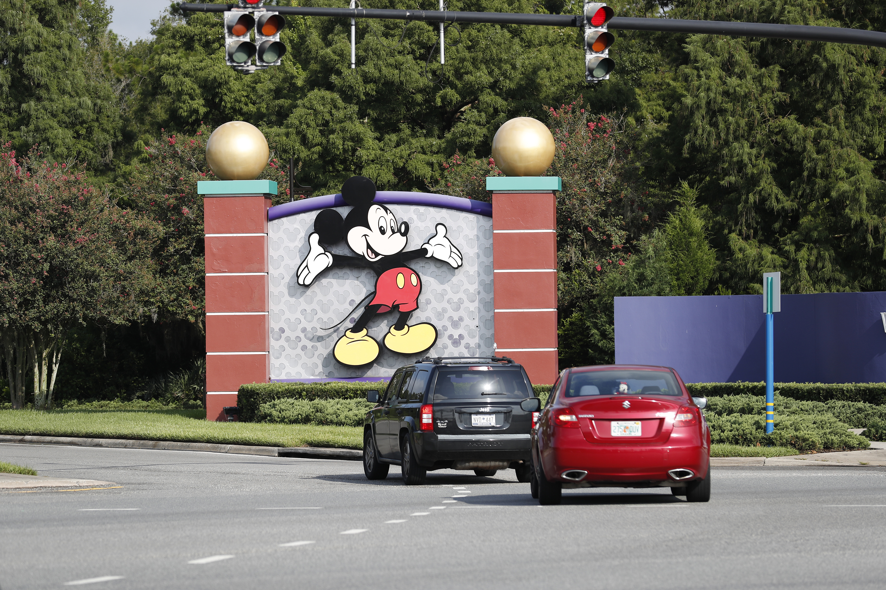 LAKE BUENA VISTA, FL - JULY 11: A view of Mickey Mouse sign at the Walt Disney World theme park entrance on July 11, 2020 in Lake Buena Vista, Florida. The theme park reopened despite a surge in new COVID-19 infections throughout Florida, including the central part of the state where Orlando is located.   Octavio Jones/Getty Images/AFP