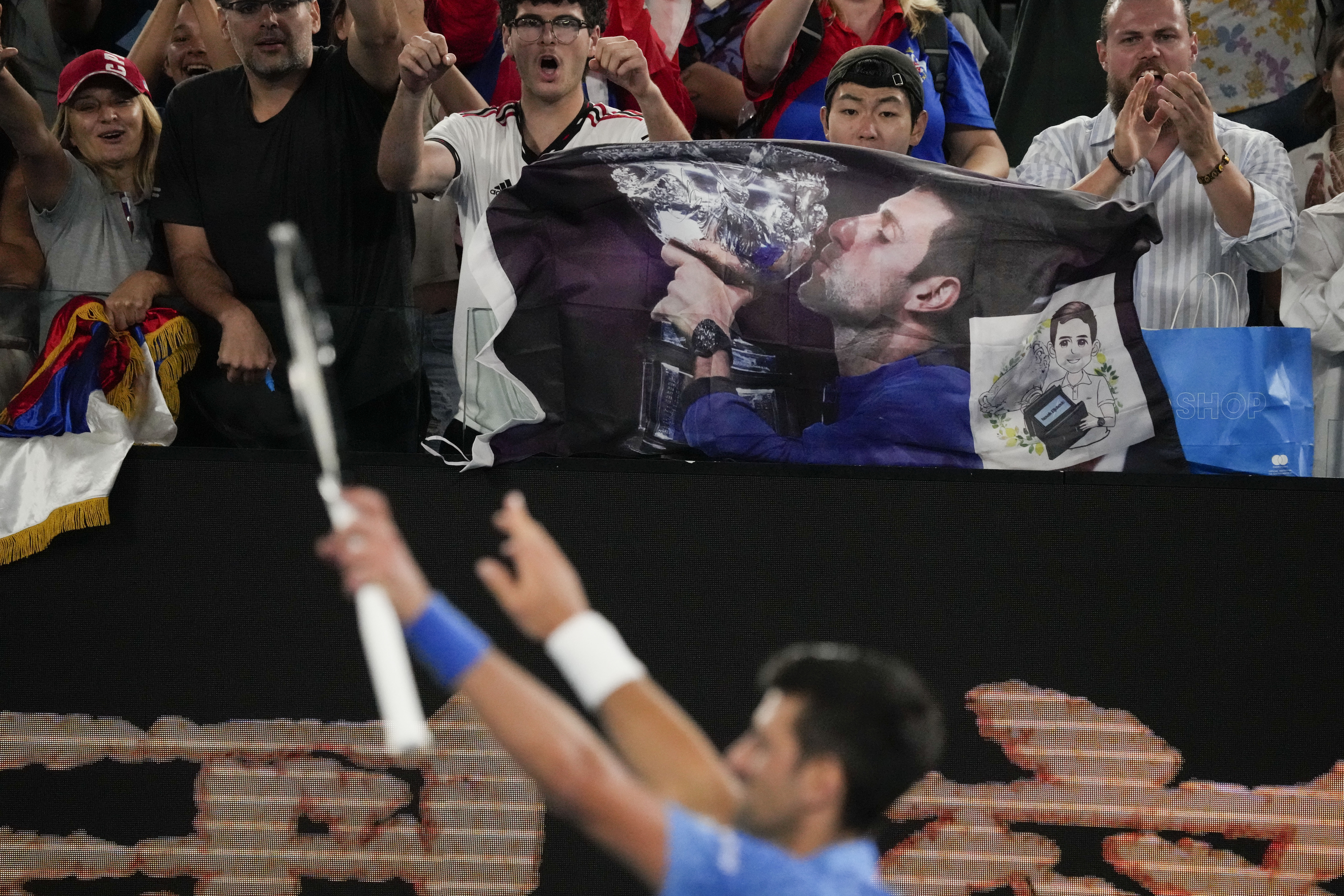 Novak Djokovic greets the crowd after beating Roberto Carballés Baena in the first round of the Australian Open, Wednesday, January 18, 2023, in Melbourne.  (AP Photo/Aaron Favila)