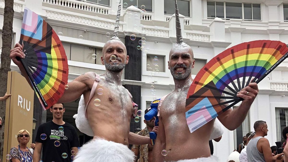 Two men celebrate in the streets of the Spanish town of Maspalomas the return of the Pride parade (Credit: EFE/ Laura Bautista)