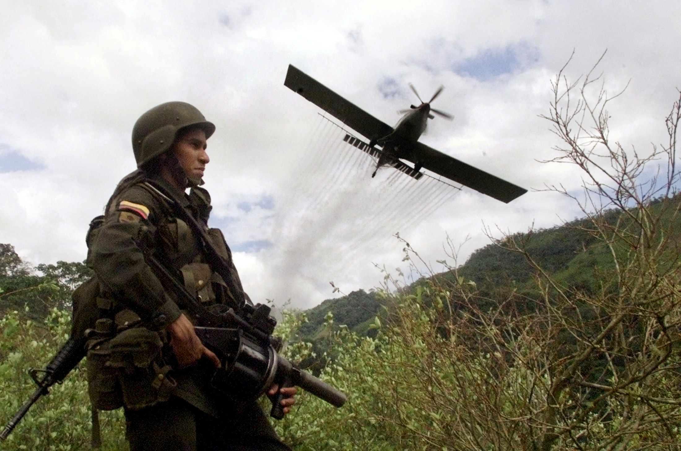 FILE PHOTO: A Turbo Thrush aircraft sprays coca leaf crops with glyphosate in the rural area of Tarazá, in the department of Antioquia, Colombia, November 30, 2020. REUTERS/Eliana Aponte/File Photo