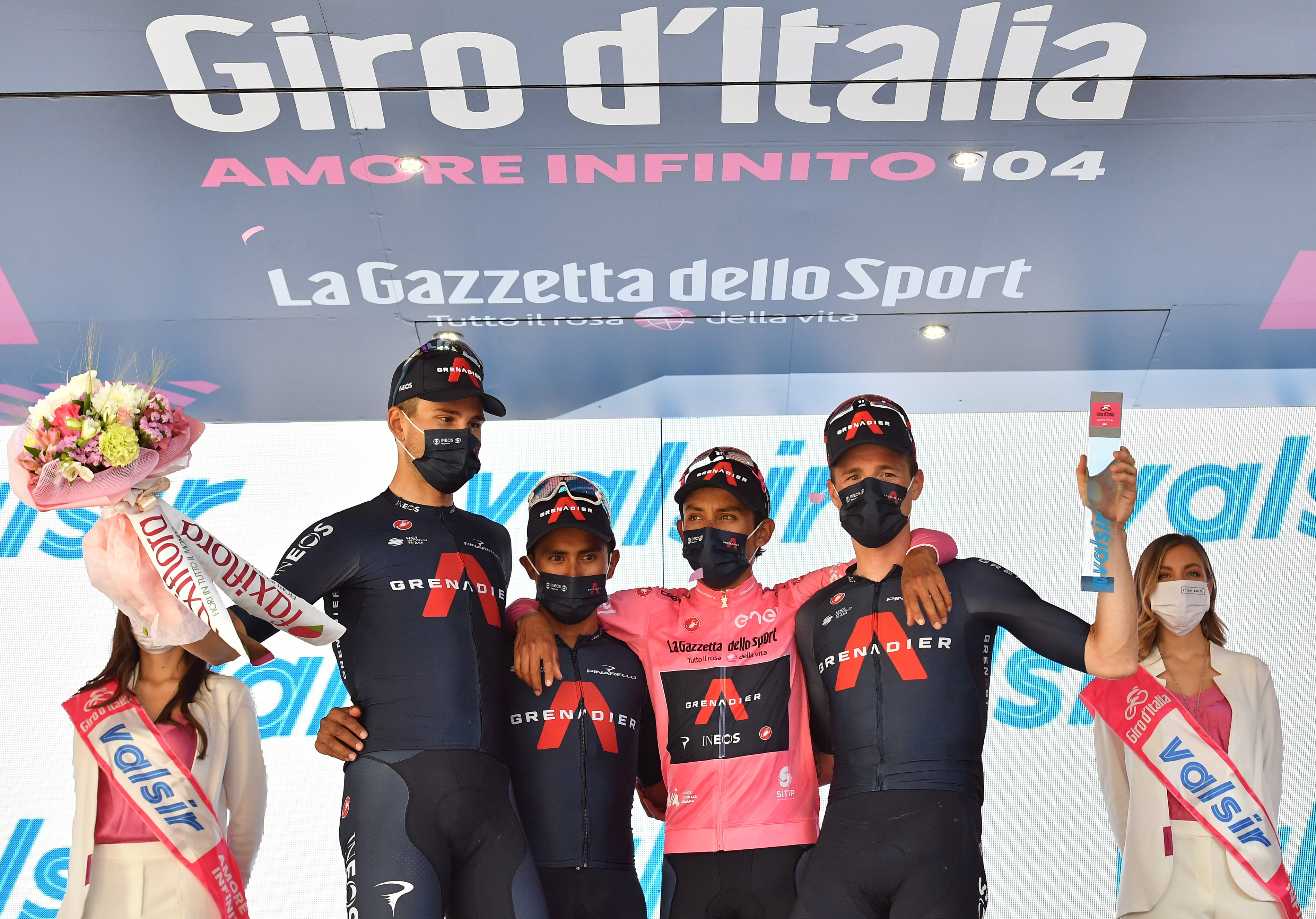 Cycling - Giro d'Italia - Stage 18 - Rovereto to Stradella, Italy - May 27, 2021 Ineos Grenadiers rider Egan Arley Bernal Gomez of Colombia celebrates wearing the maglia rosa on the podium after stage 18 with Jonathan Narvaez,  Salvatore Puccio and Filippo Ganna REUTERS/Jennifer Lorenzini