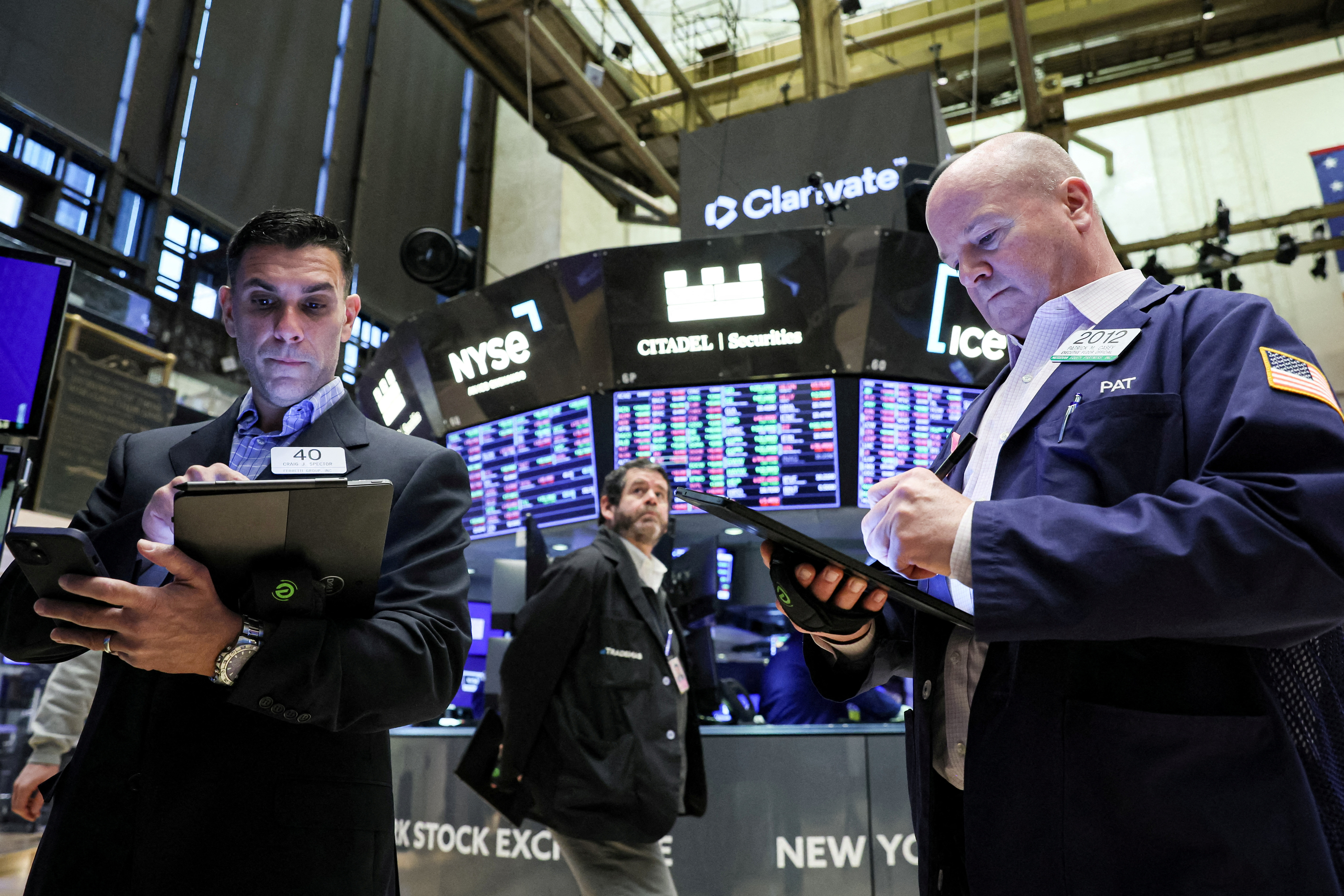 Workers on the floor of the New York Stock Exchange (REUTERS/Brendan McDermid)