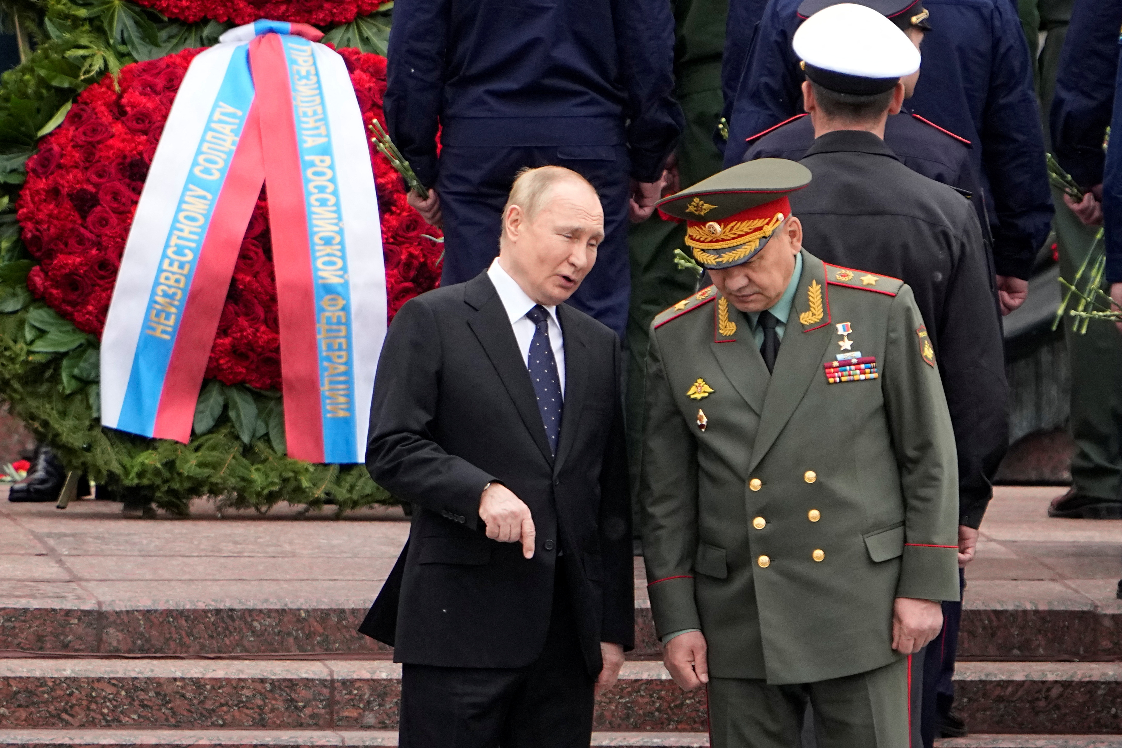 Russian President Vladimir Putin and Defence Minister Sergei Shoigu attend a wreath-laying ceremony in Moscow