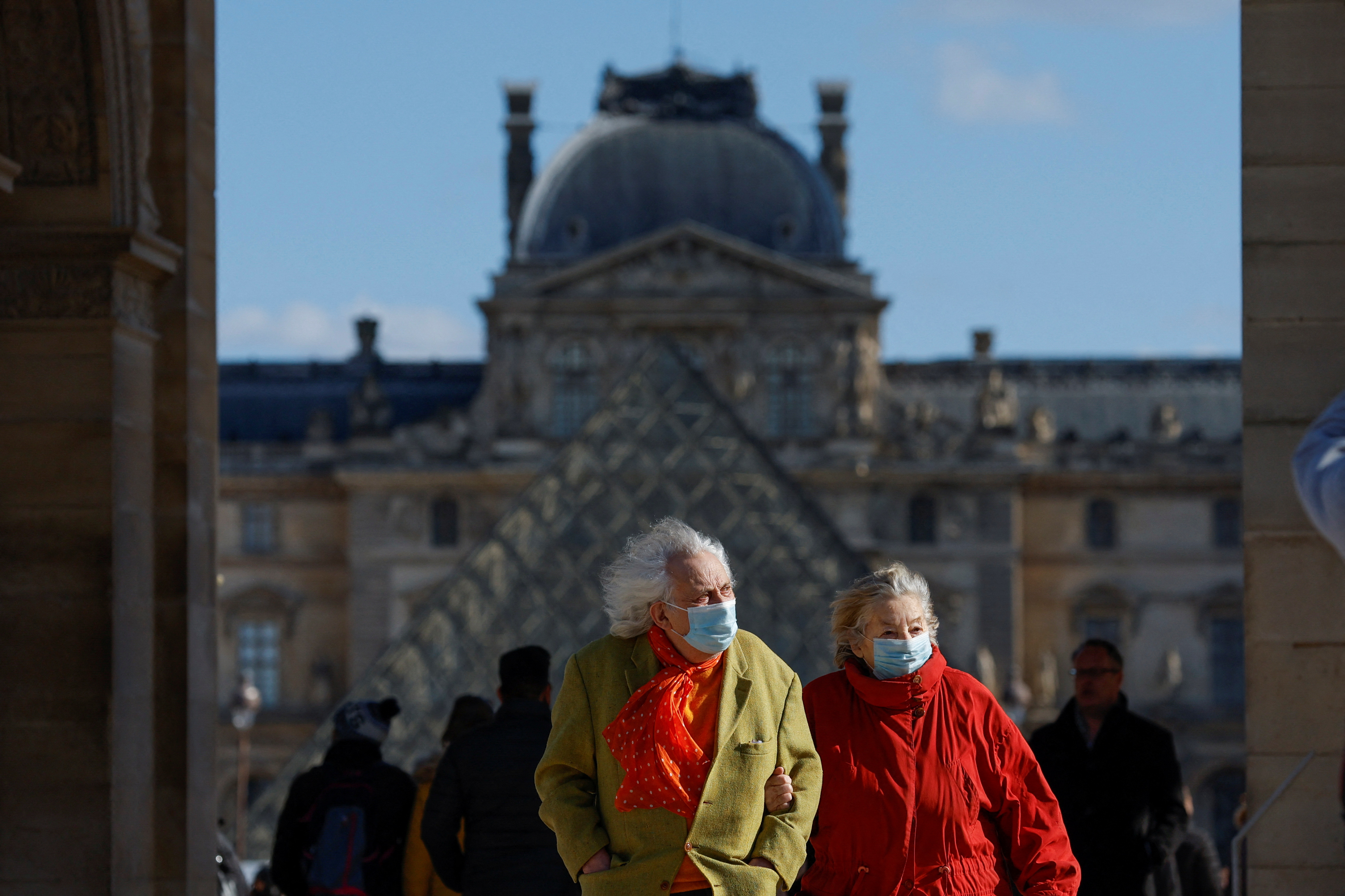 An adult couple walks through the Louvre Museum in Paris.  REUTERS/Gonzalo Fuentes