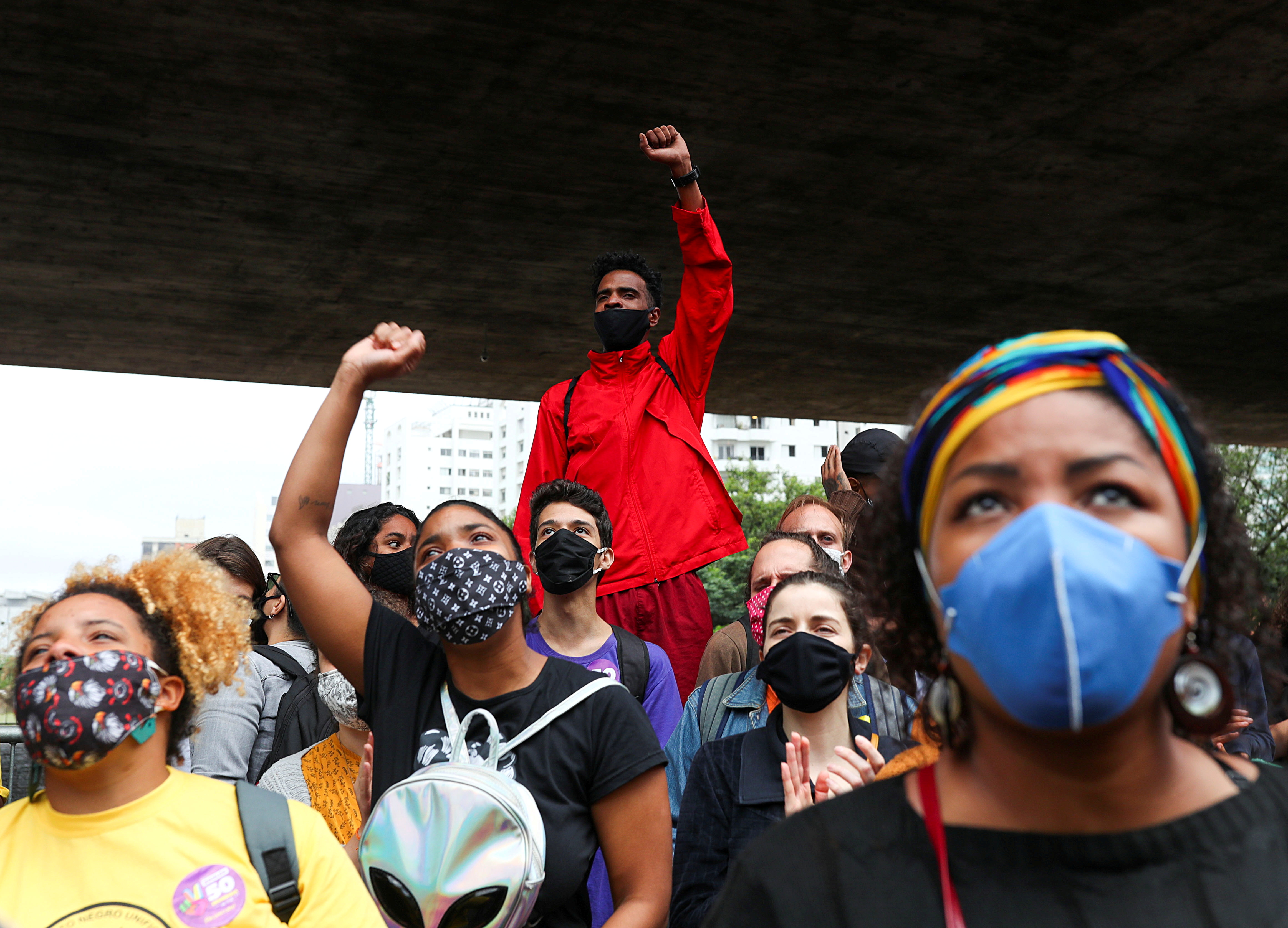 Demonstrators gesture as they march in Sao Paulo during the National Black Consciousness Day and in protest against the death of Joao Alberto Silveira Freitas, a Black man beaten to death at a market in Porto Alegre, Brazil November 20, 2020. REUTERS/Amanda Perobelli