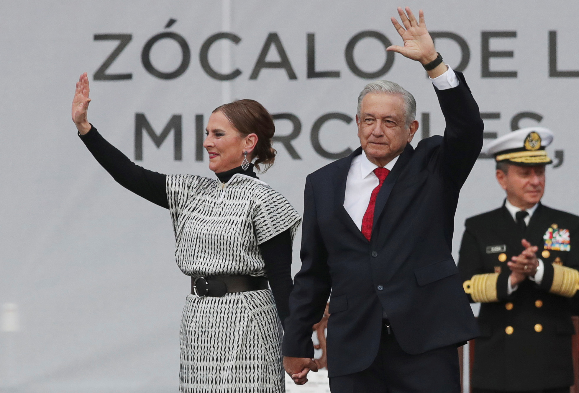 Mexico’s President Andres Manuel Lopez Obrador and his wife Beatriz Gutierrez Muller wave on stage  during an event on the third anniversary of his government in Mexico City, Mexico December 1, 2021. REUTERS/Henry Romero