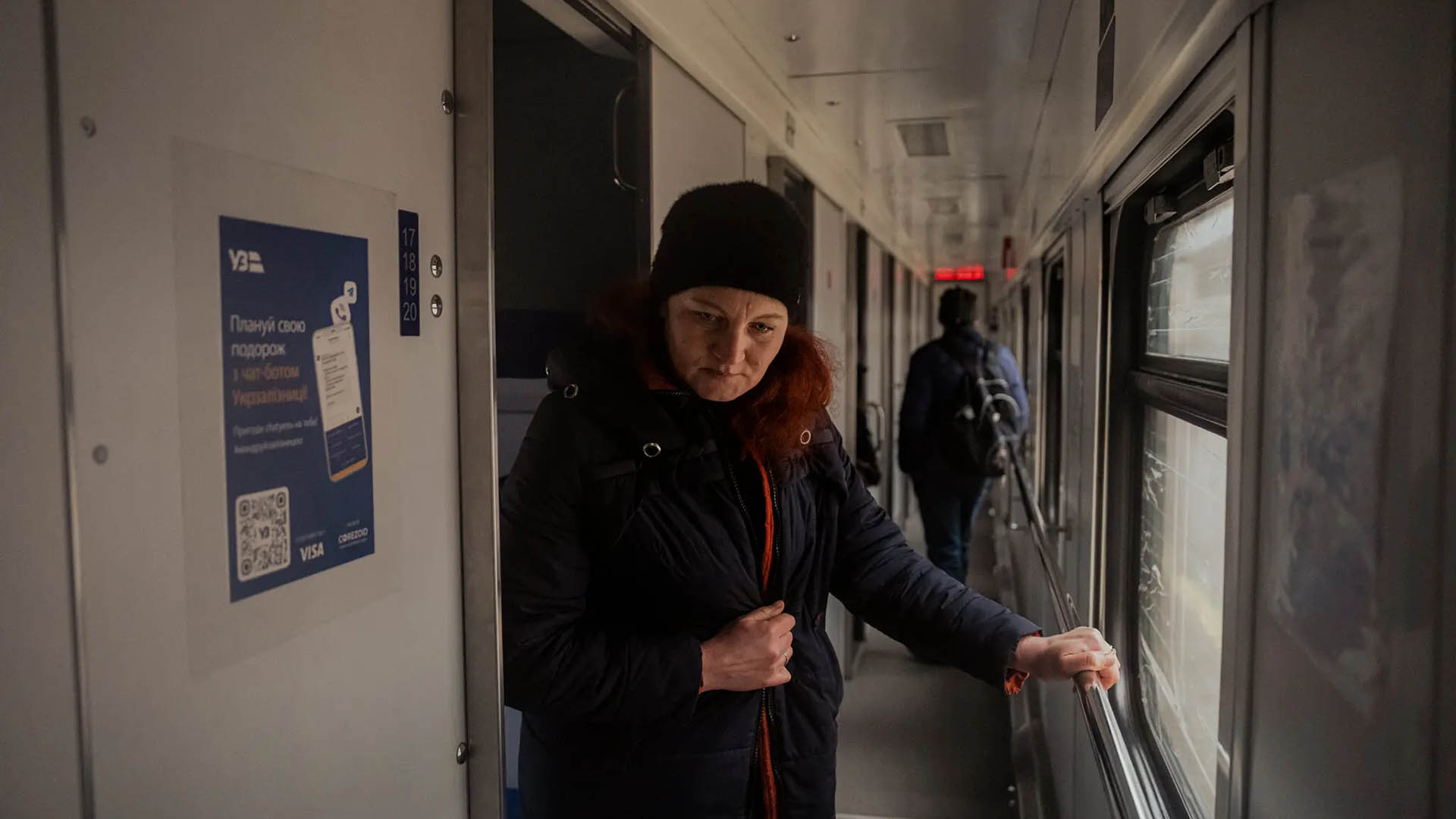 Natalya Zhornyk leaves her cabin at a train station in Kharkiv, Ukraine, ahead of the trip to retrieve her son, Artem, on March 12, 2023. (Daniel Berehulak/The New York Times)