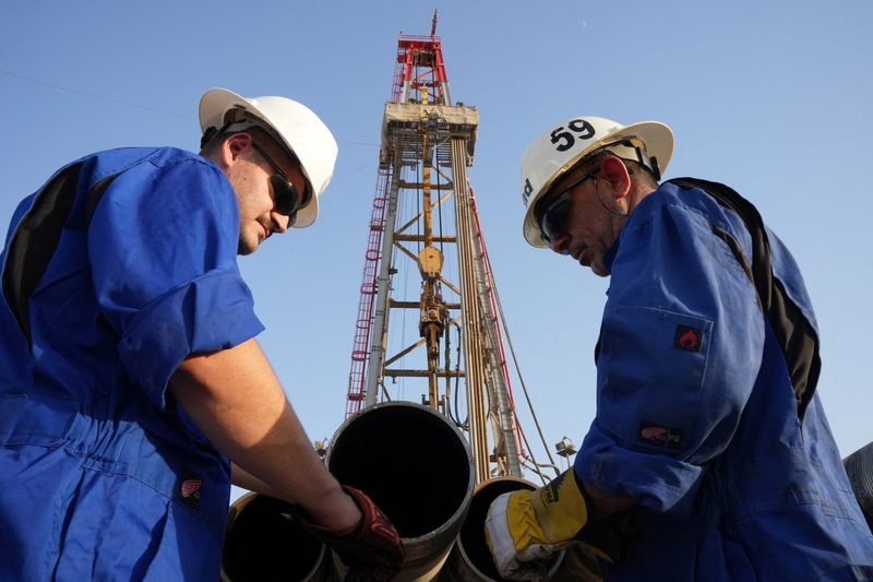 File image of workers checking drill pipes for the Iraqi Drilling Company at the Zubair oil field in Basra, Iraq.  July 5, 2022. REUTERS/Essam Al-Sudani/File