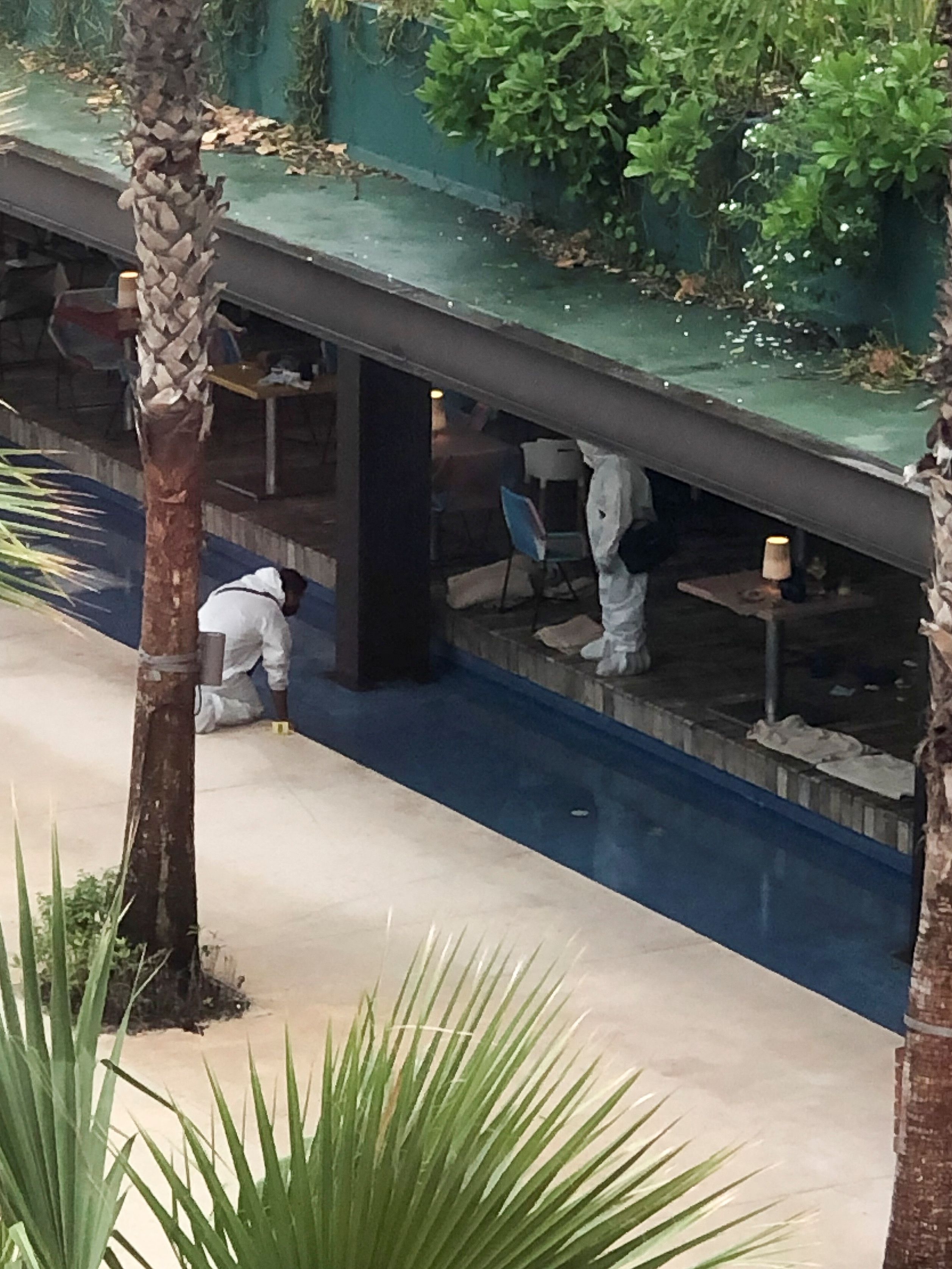 Forensic technicians work at a scene where three Canadian citizens were injured by gunshots at Hotel Xcaret, in Playa del Carmen, Mexico January 21, 2022. REUTERS/Stringer NO RESALES. NO ARCHIVES