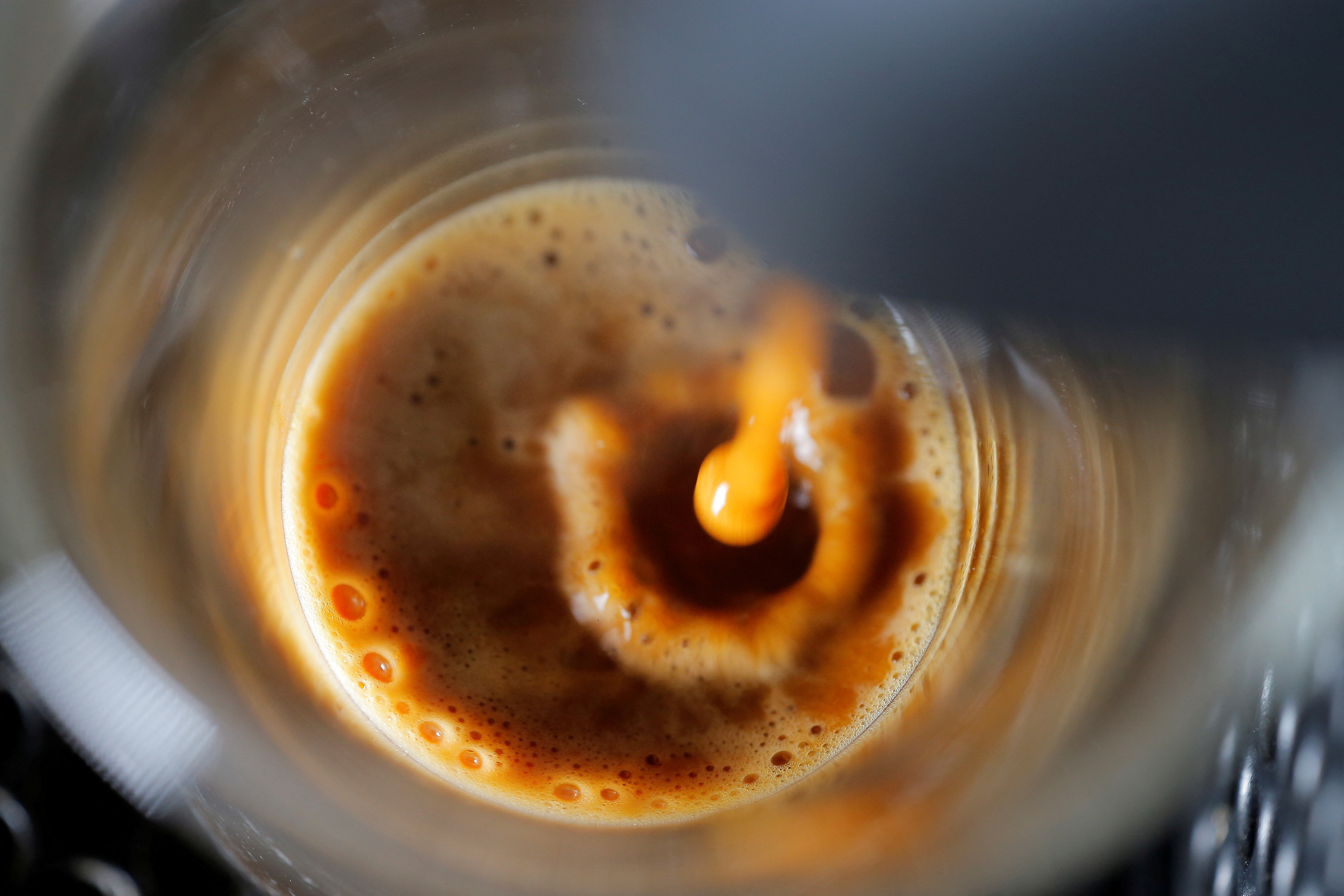 FILE PHOTO: A photo illustration shows an automatic coffee machine pouring an espresso into a glass in a home in Sydney, Australia May 3, 2017. REUTERS/Jason Reed/Illustration/File Photo
