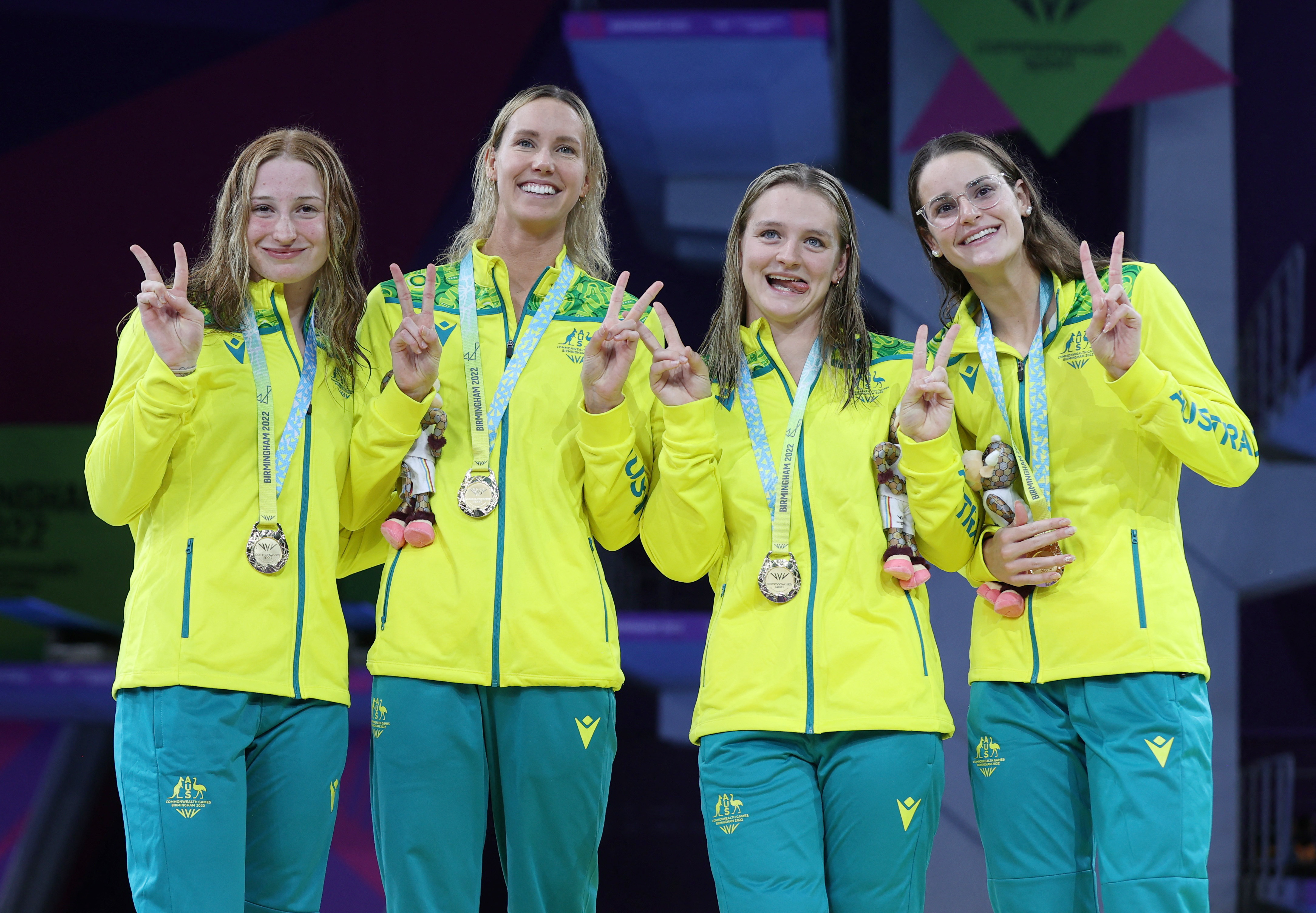 Commonwealth Games - Swimming - Women's 4 x 100m Medley Relay - Medal Ceremony - Sandwell Aquatics Centre, Birmingham, Britain - August 3, 2022 Gold Medallists Australia's Mollie O'Callaghan, Emma McKeon, Chelsea Hodges and Kaylee McKeown celebrate on the podium during the medal ceremony REUTERS/Stoyan Nenov