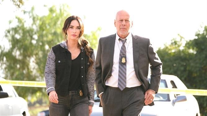 Megan Fox and Bruce Willis as Karl Helter and his partner, Rebecca Lombardo.  (Lionsgate)