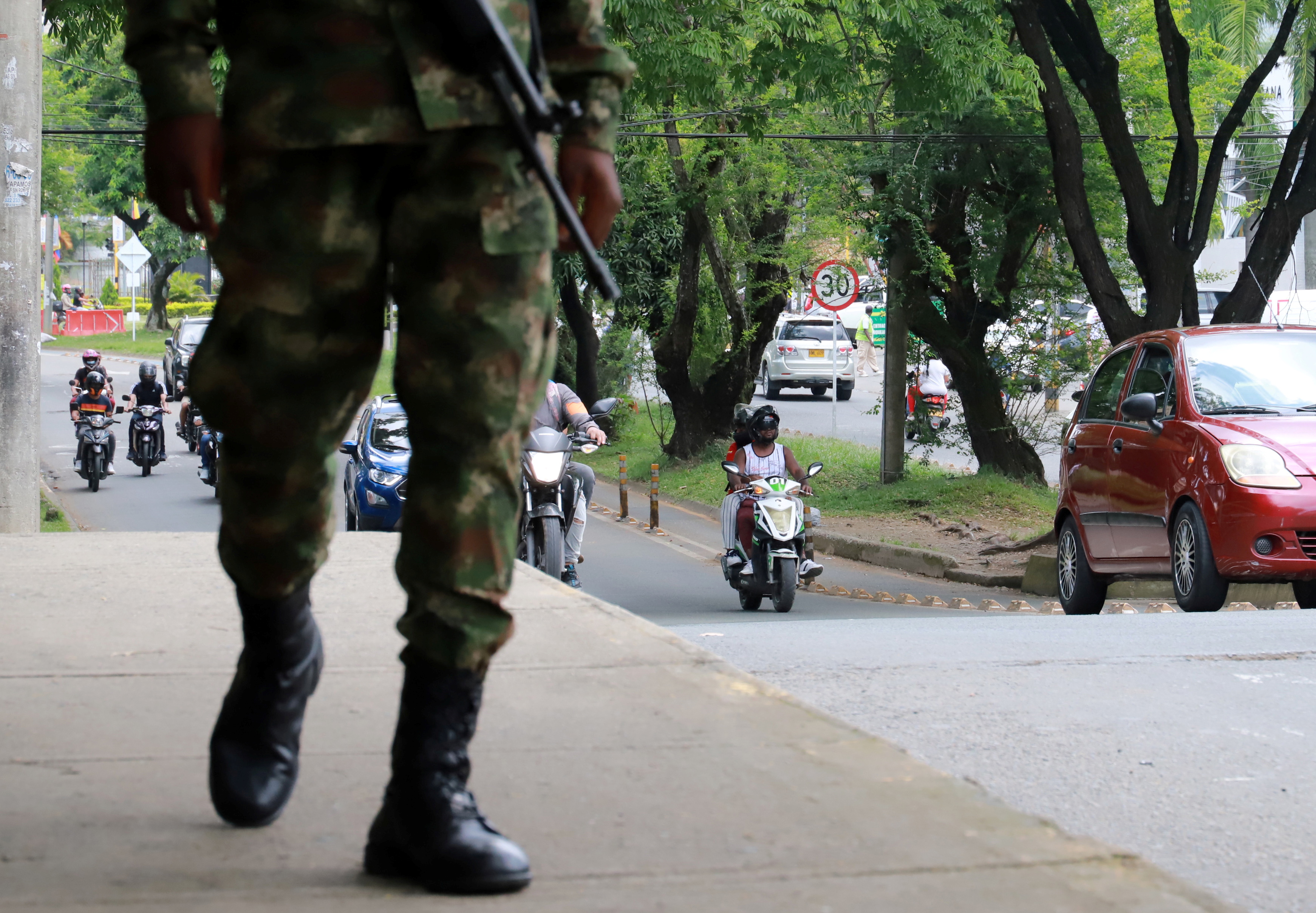 A security force member patrols in Cali, as Colombia will begin "the maximum deployment" of military personnel in the western province of Valle del Cauca and its regional capital, President Ivan Duque said on Friday, after four people died in protests to mark a month of anti-government demonstrations, May 29, 2021. REUTERS/Juan B Diaz NO RESALES. NO ARCHIVES