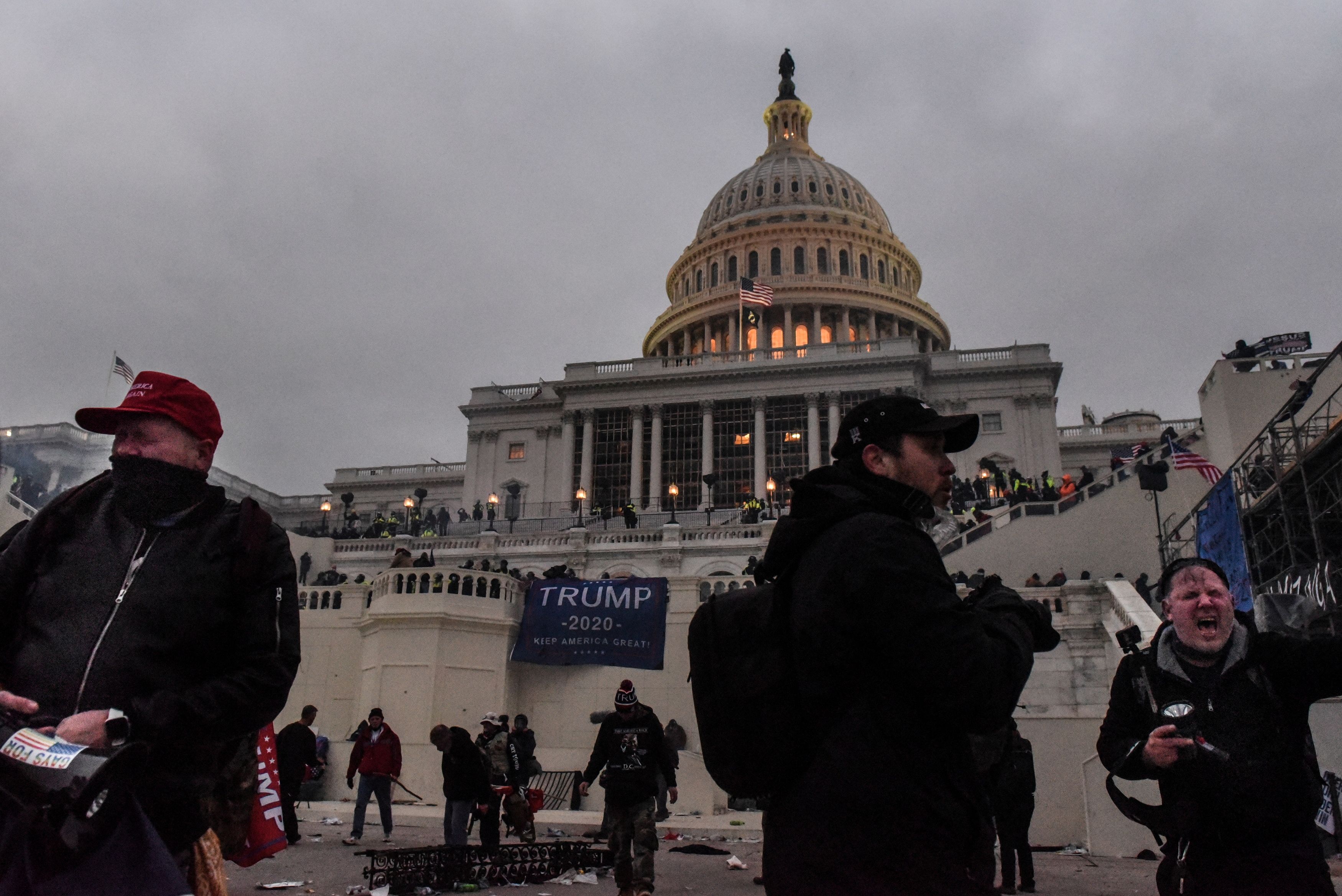 Supporters of U.S. President Donald Trump leave the Capitol building after being tear gassed during a "Stop the Steal" protest outside of the Capitol building in Washington D.C. U.S. January 6, 2021. Picture taken January 6, 2021. REUTERS/Stephanie Keith