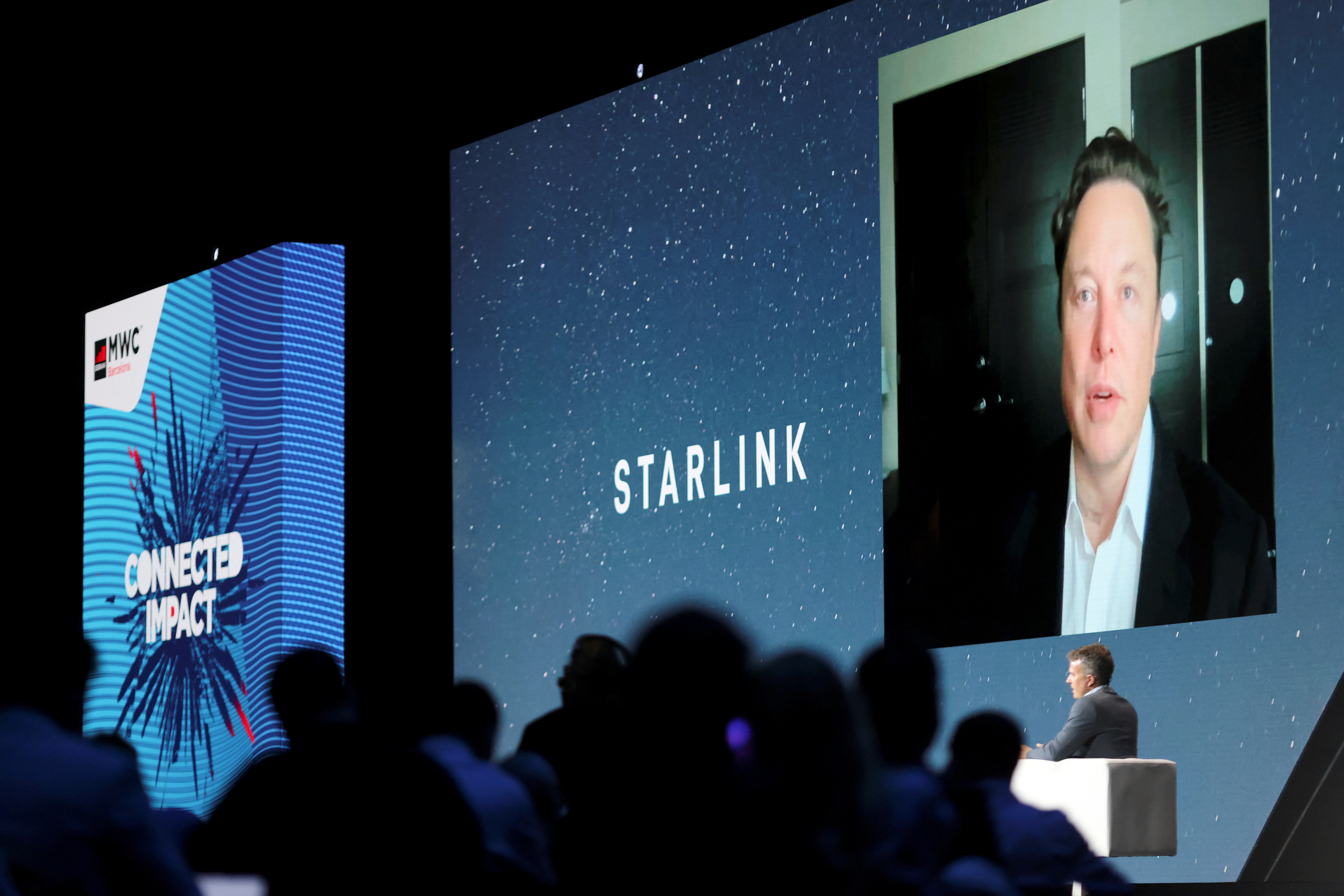 FILE PHOTO: SpaceX founder and Tesla CEO Elon Musk speaks on a screen during the Mobile World Congress (MWC) in Barcelona, Spain, June 29, 2021. REUTERS/Nacho Doce/File Photo