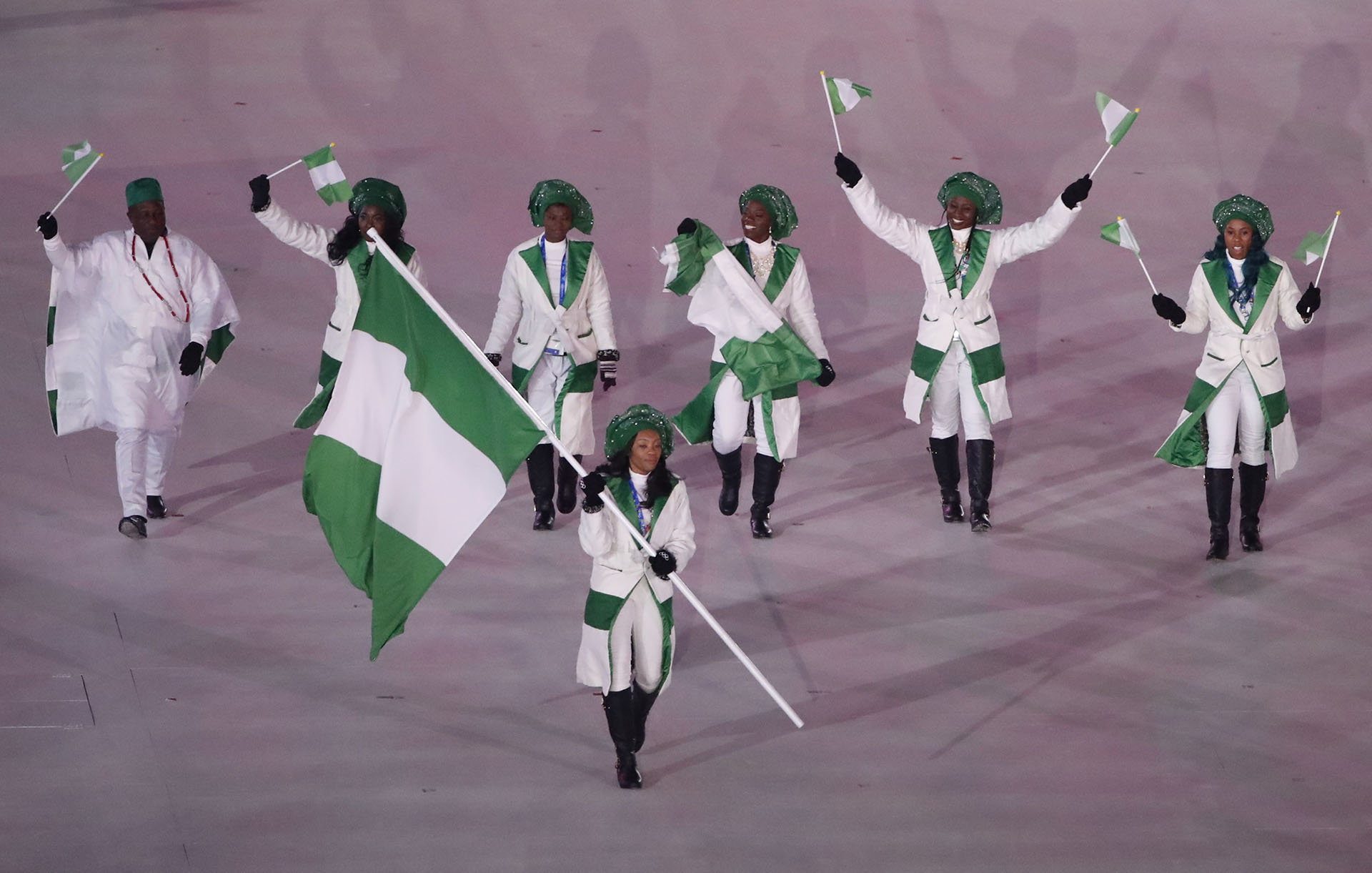 Pyeongchang 2018 Winter Olympics – Opening ceremony – Pyeongchang Olympic Stadium - Pyeongchang, South Korea – February 9, 2018 - Ngozi Onwumere of Nigeria carries the national flag. REUTERS/Stefano Rellandini