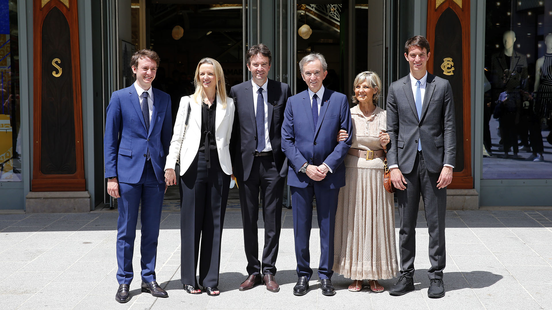Bernard Arnold (C) and his wife Helen with their children (from left) Frederic Arnold, Delphine Arnold, Antoine Arnold and Alexandre Arnold in an April 2021 photo (Chesnot/Getty Images)