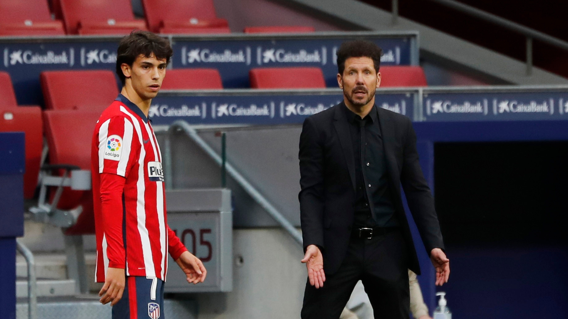 Soccer Football - La Liga Santander - Atletico Madrid v Real Madrid - Wanda Metropolitano, Madrid, Spain - March 7, 2021 Atletico Madrid coach Diego Simeone reacts as Joao Felix looks on REUTERS/Susana Vera