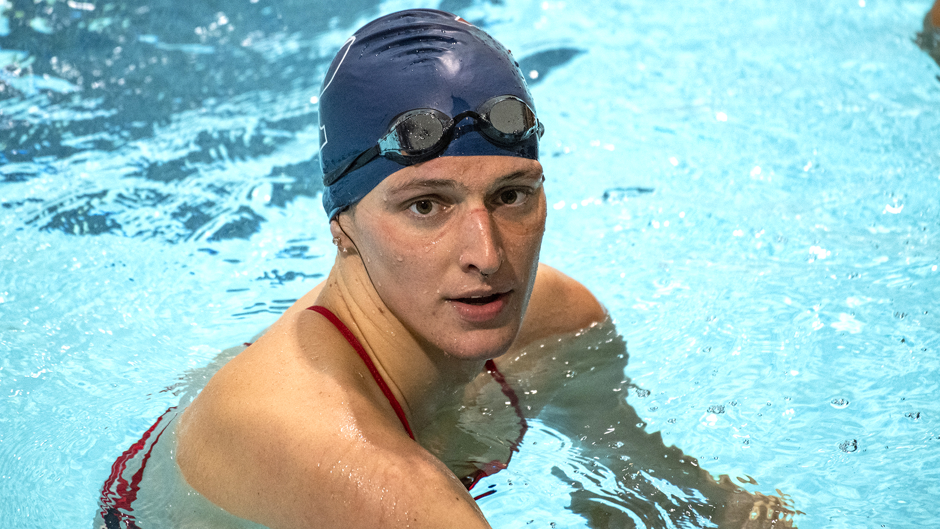 (FILES) In this file photo taken on January 22, 2022, US swimmer Lia Thomas, a transgender woman, finishes the 200-yard Freestyle for the University of Pennsylvania at an Ivy League swim meet against Harvard University in Cambridge, Massachusetts. - Thomas' controversial career as a transgender swimmer hung in the balance on February 2, 2022, after the collegiate body governing the sport announced new rules that could impact her ability to race competitively. USA Swimming said it created a new set of guidelines at the elite level for transgender athlete participation that "relies on science and medical evidence-based methods to provide a level-playing field for elite cisgender women, and to mitigate the advantages associated with male puberty and physiology." (Photo by Joseph Prezioso / AFP)