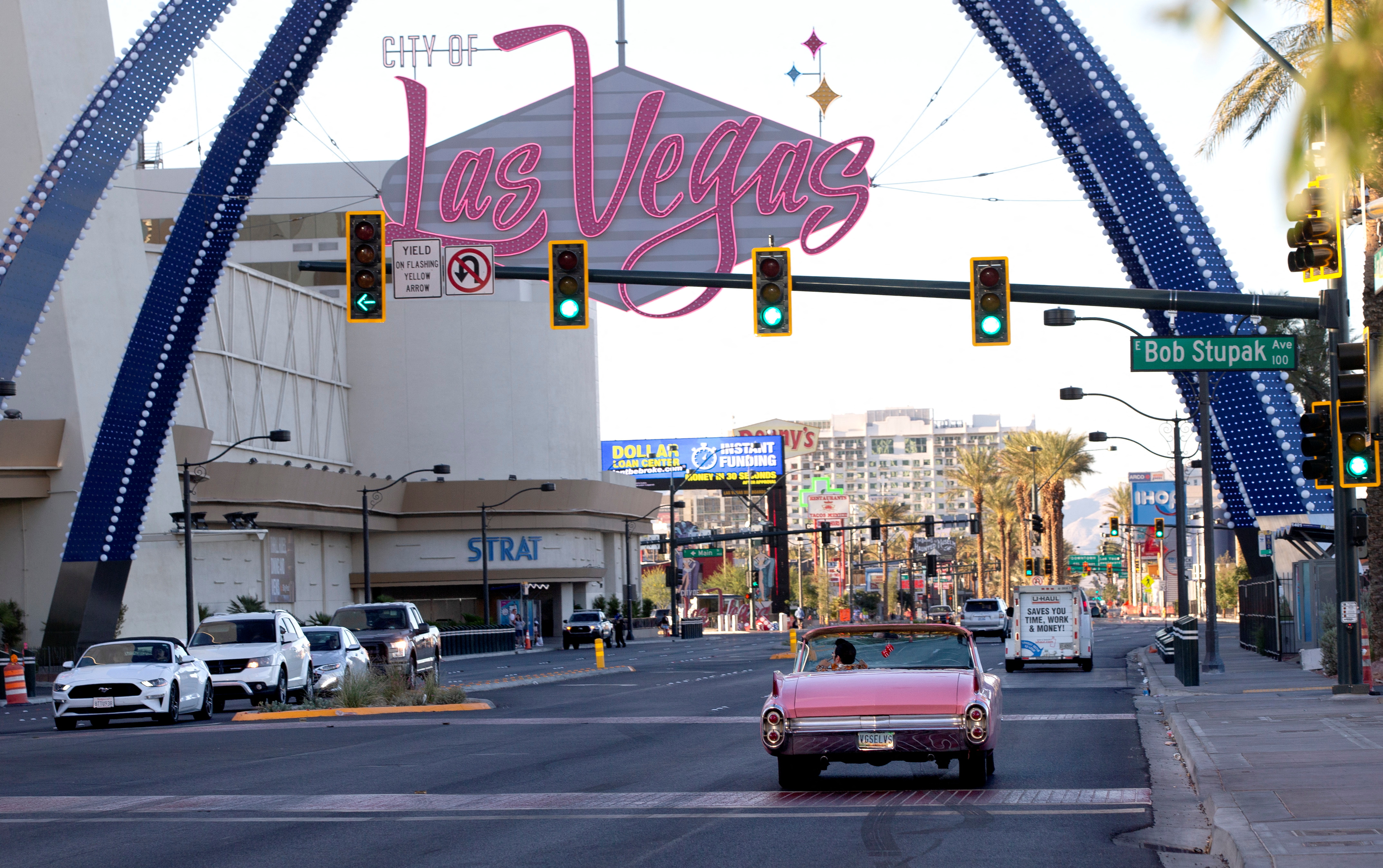 Elvis Presley tribute artist Jesse Garon heads northbound on the Las Vegas Strip in his 1960 Cadillac convertible after a marriage marriage vow renewal ceremony at Little Chapel of Hearts in Las Vegas, Nevada, U.S. June 1, 2022.  REUTERS/Steve Marcus