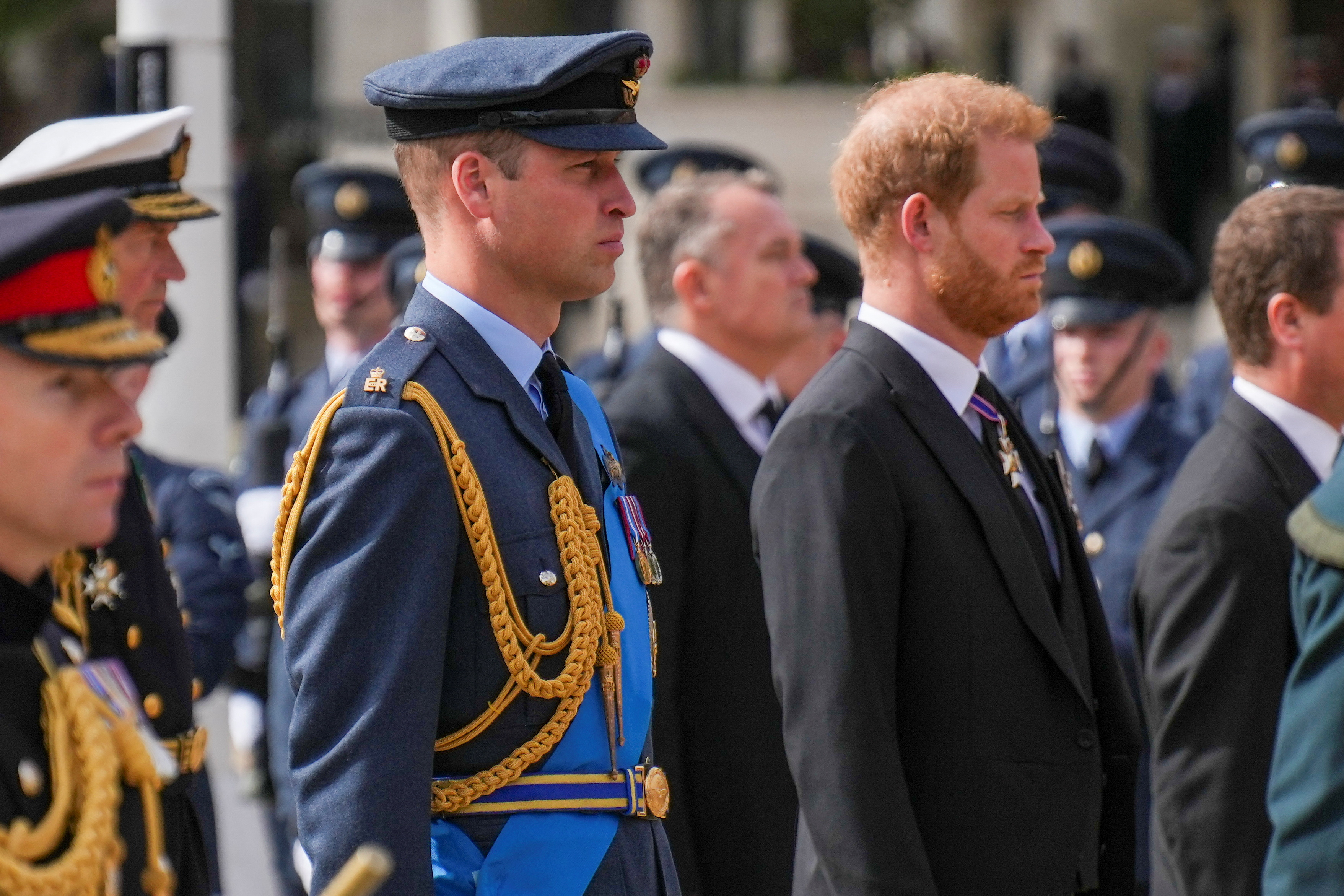 Prince William and Prince Harry walk behind the coffin of Queen Elizabeth II as it is pulled on a gun carriage through the streets of London following her funeral service at Westminster Abbey, Monday Sept. 19, 2022.The Queen, who died aged 96 on Sept. 8, will be buried at Windsor alongside her late husband, Prince Philip, who died last year.  Emilio Morenatti/Pool via REUTERS