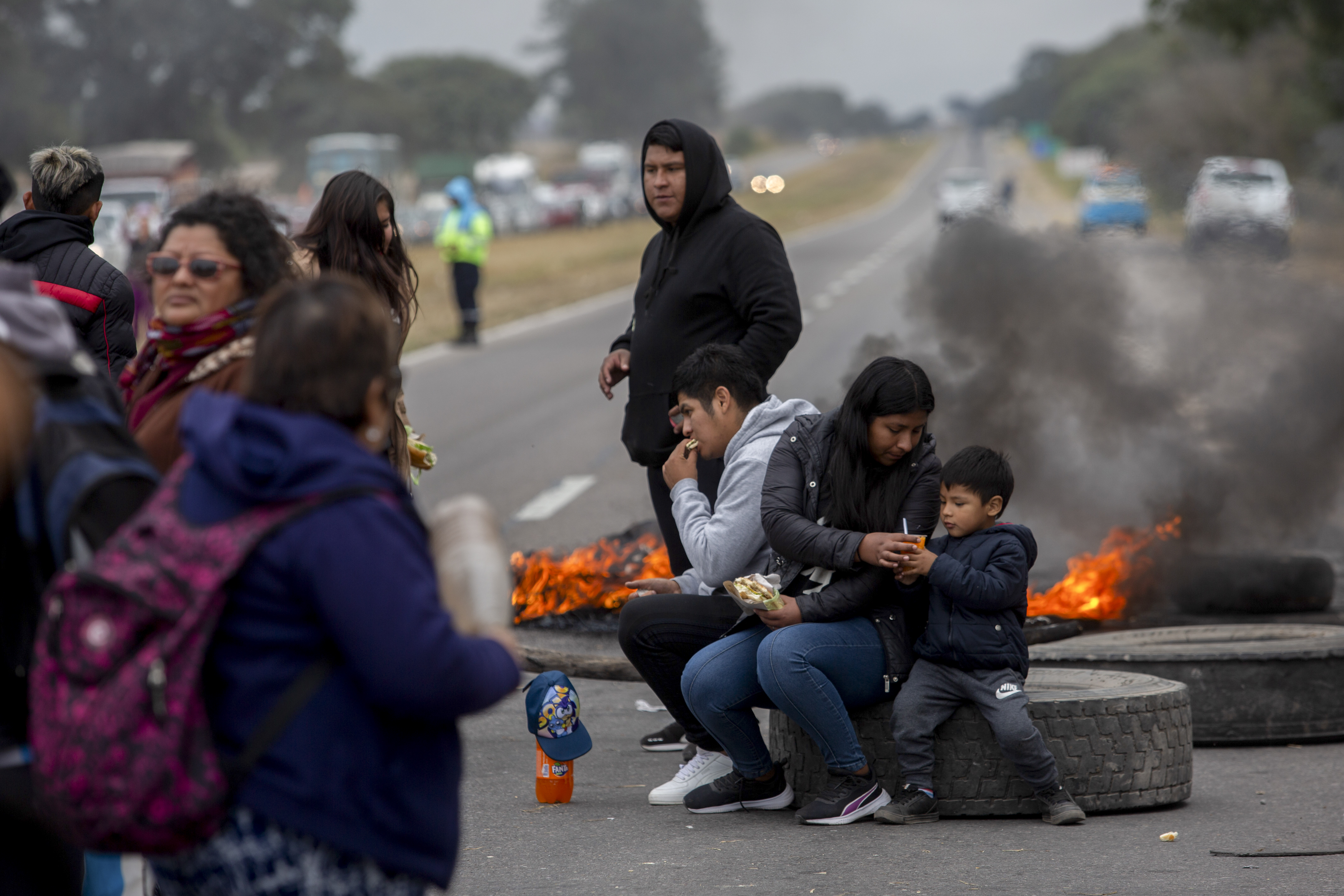 Demonstrators protest against the blockade of a highway on the outskirts of San Salvador de Jujuy, Argentina, Tuesday, June 20, 2023. Demonstrations erupted in the province of Jujuy in reaction to a recent reform of the provincial constitution criticized for its restrictions on social protest.  (AP Photo/Javier Corbalan)