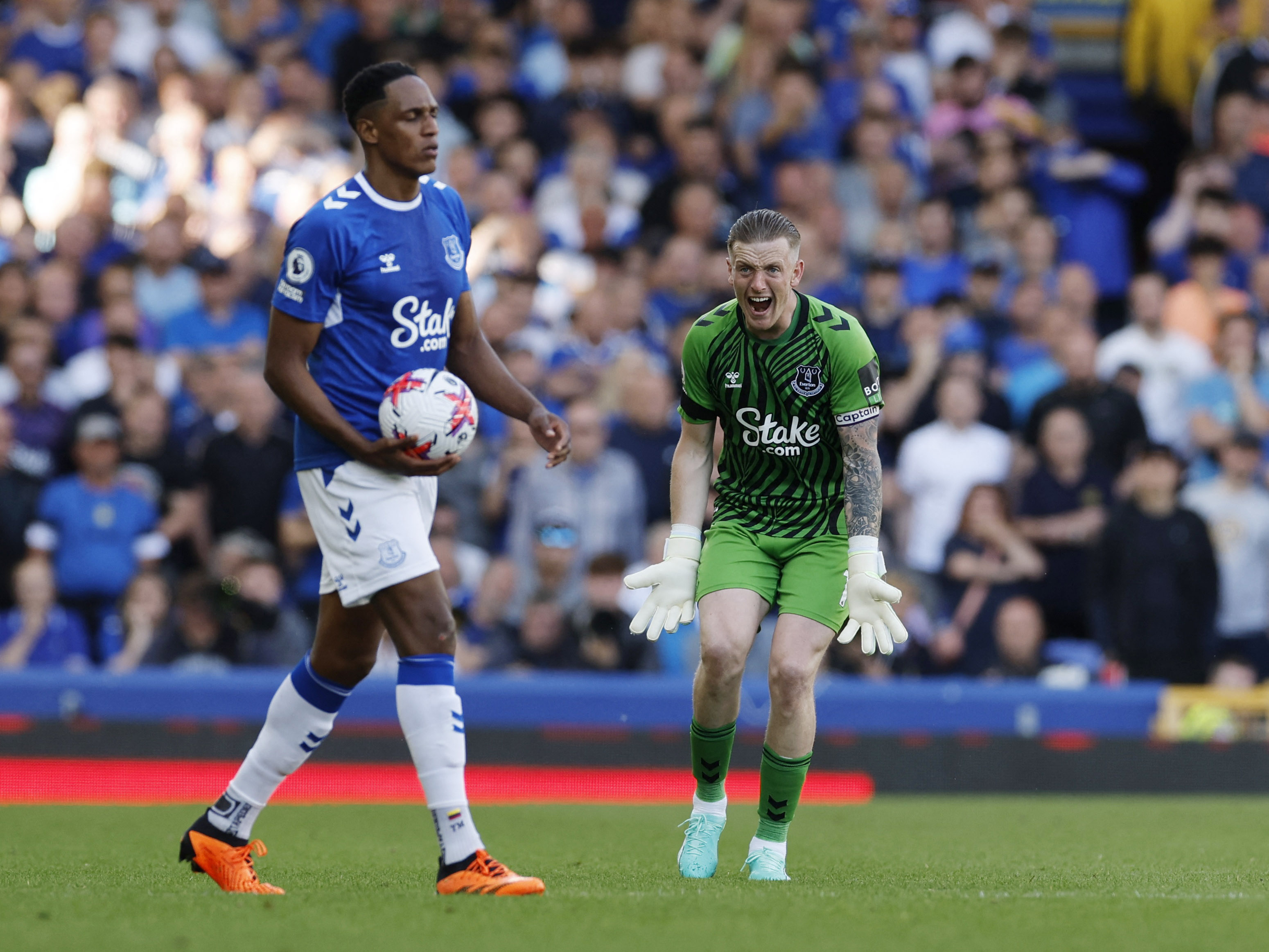Soccer Football - Premier League - Everton v AFC Bournemouth - Goodison Park, Liverpool, Britain - May 28, 2023 Everton's Yerry Mina and Jordan Pickford react Action Images via Reuters/Jason Cairnduff EDITORIAL USE ONLY. No use with unauthorized audio, video, data, fixture lists, club/league logos or 'live' services. Online in-match use limited to 75 images, no video emulation. No use in betting, games or single club /league/player publications.  Please contact your account representative for further details.
