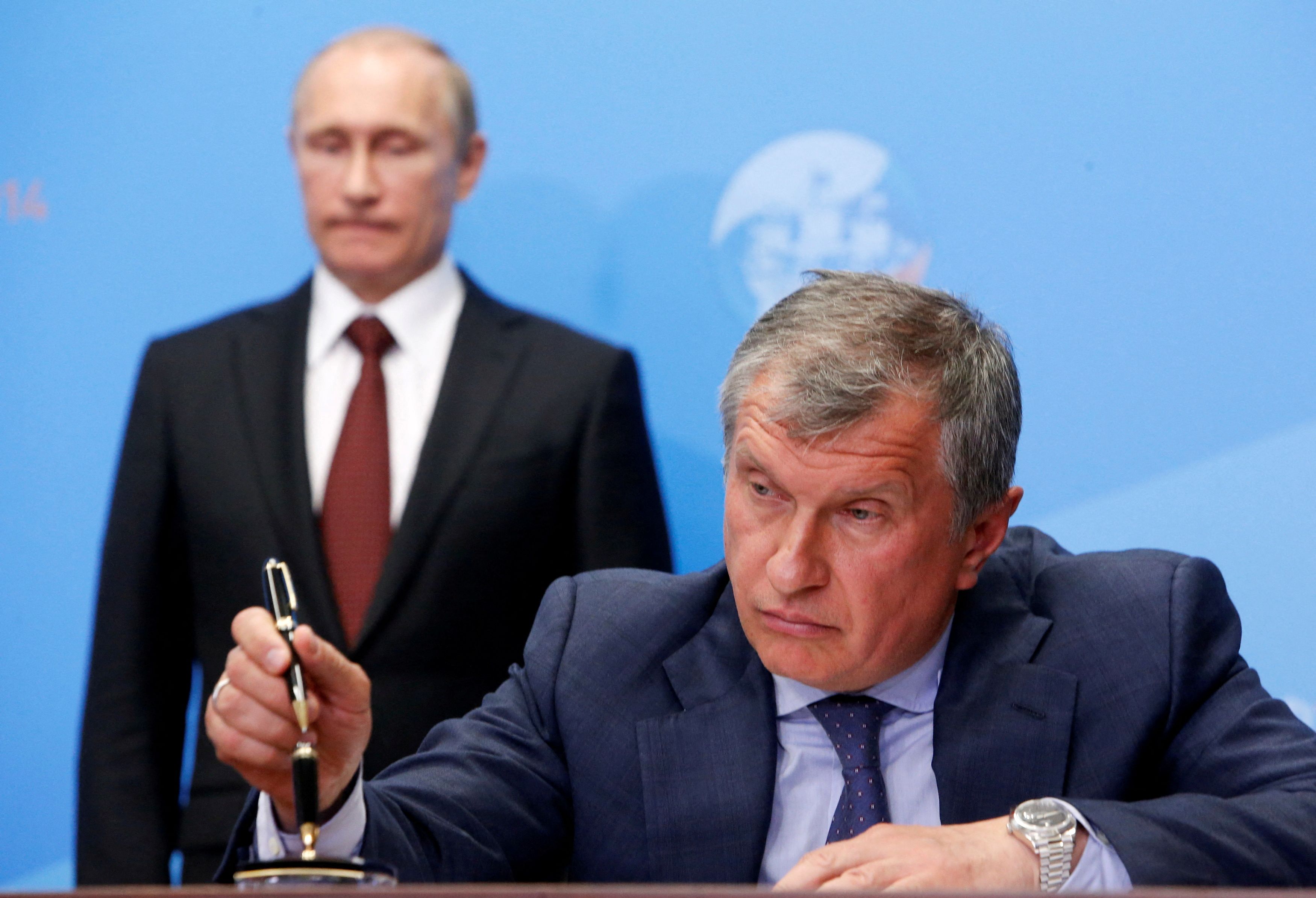 Otra foto junto a Putin, en este caso en 2014 en San Petersburgo (REUTERS/Sergei Karpukhin)