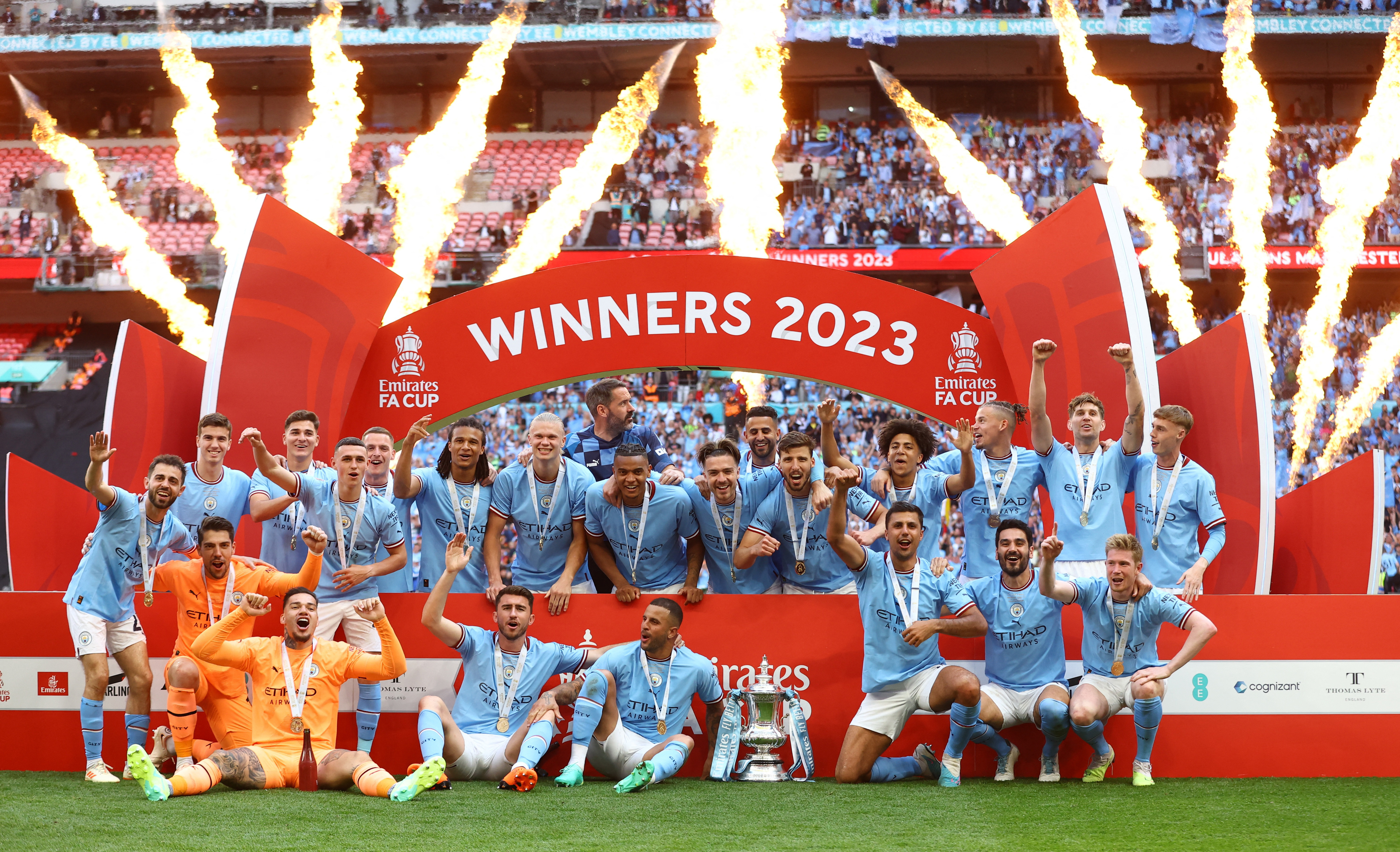 Soccer Football - FA Cup Final - Manchester City v Manchester United - Wembley Stadium, London, Britain - June 3, 2023 Manchester City players celebrate with the trophy after winning the FA Cup REUTERS/Carl Recine