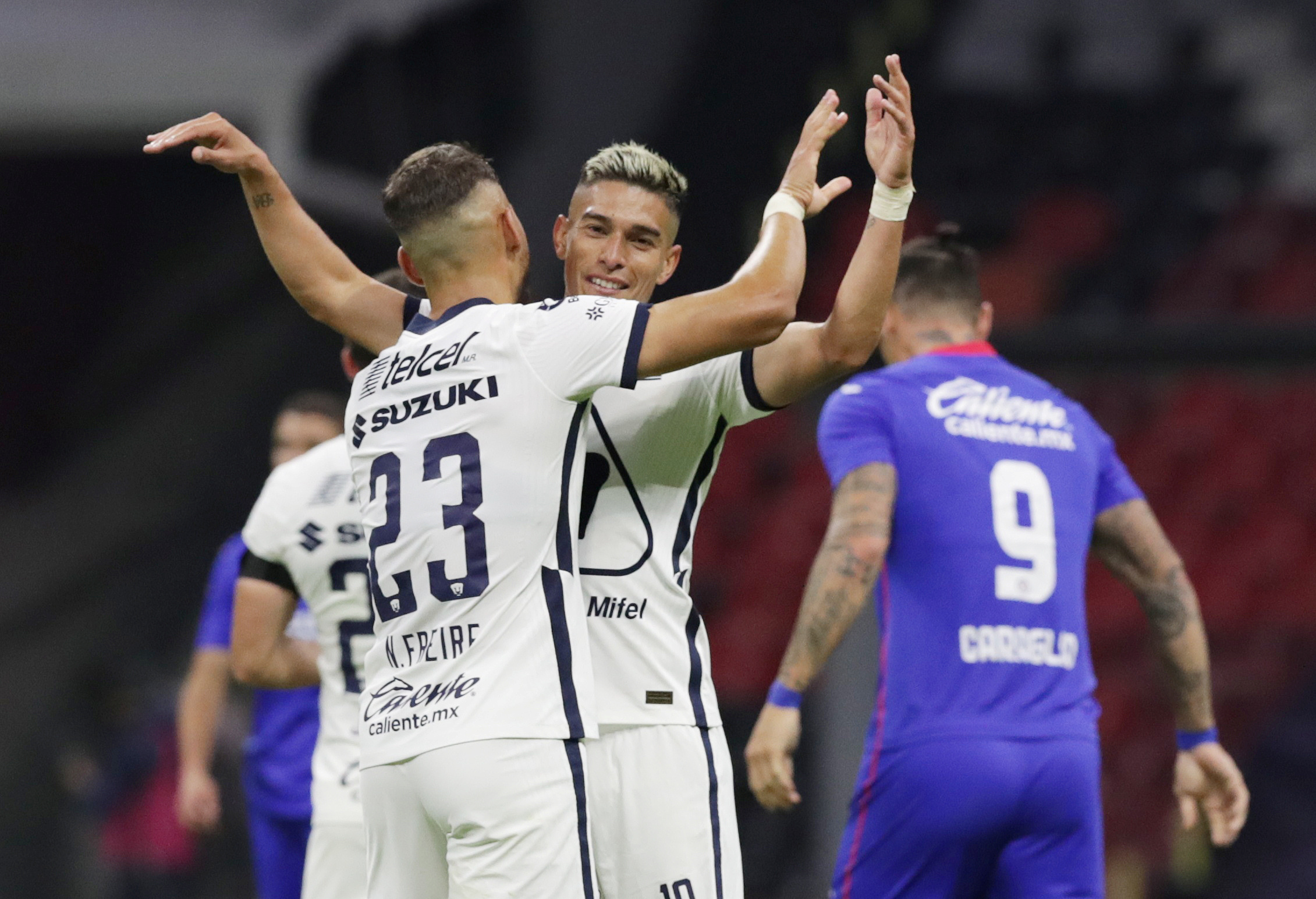 Soccer Football - Liga MX - Cruz Azul v Pumas UNAM - Estadio Azteca, Ciudad de Mexico, Mexico - November 7, 2020 Pumas' Nicolas Freire and Facundo Alvarez celebrate after the match REUTERS/Henry Romero