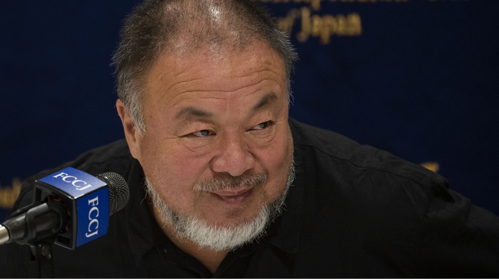 Ai Weiwei, at a press conference (AFP)