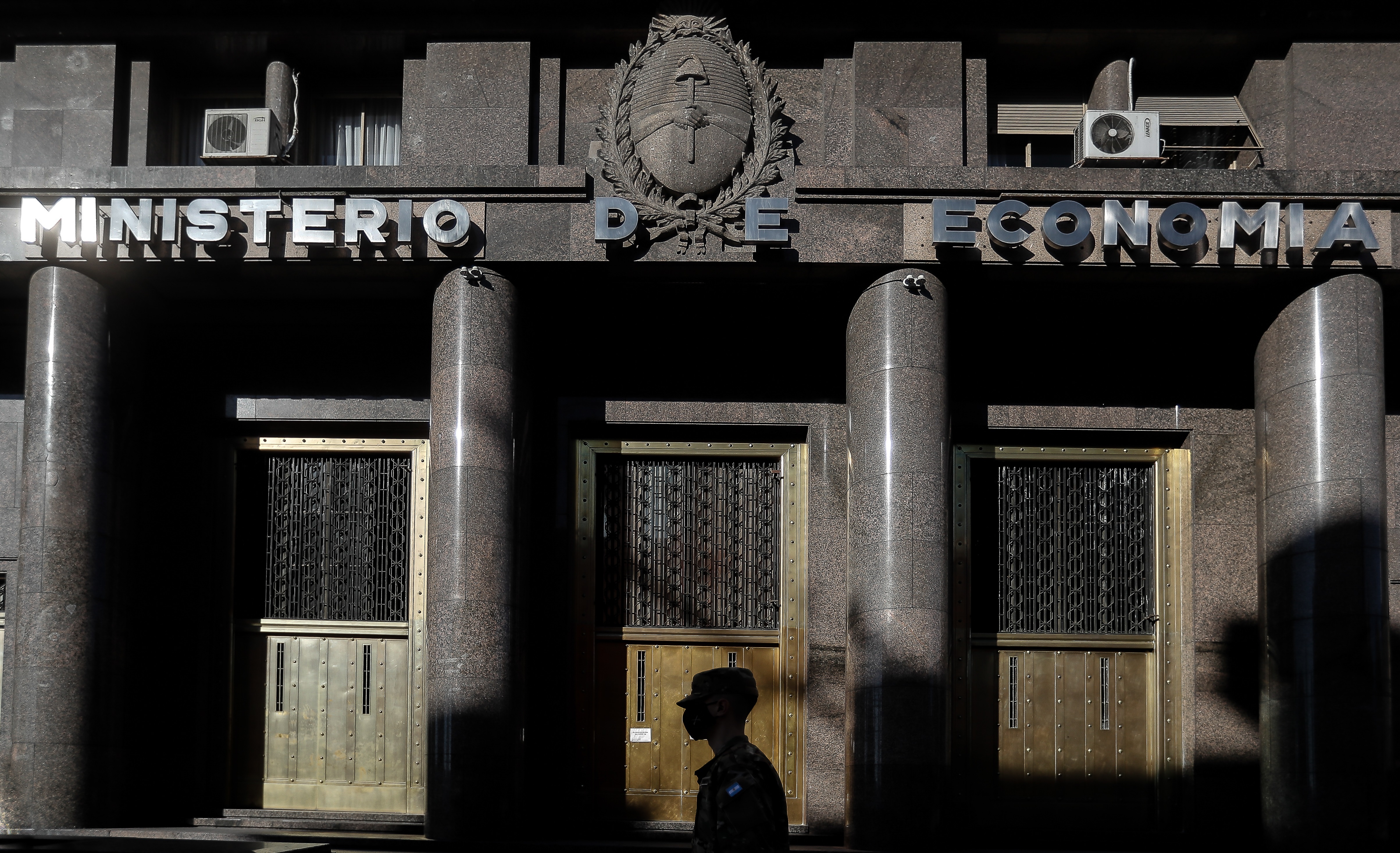 A person walks in front of the Ministry of Economy in Buenos Aires (Argentina), in a file photograph.  EFE/Juan Ignacio Roncoroni