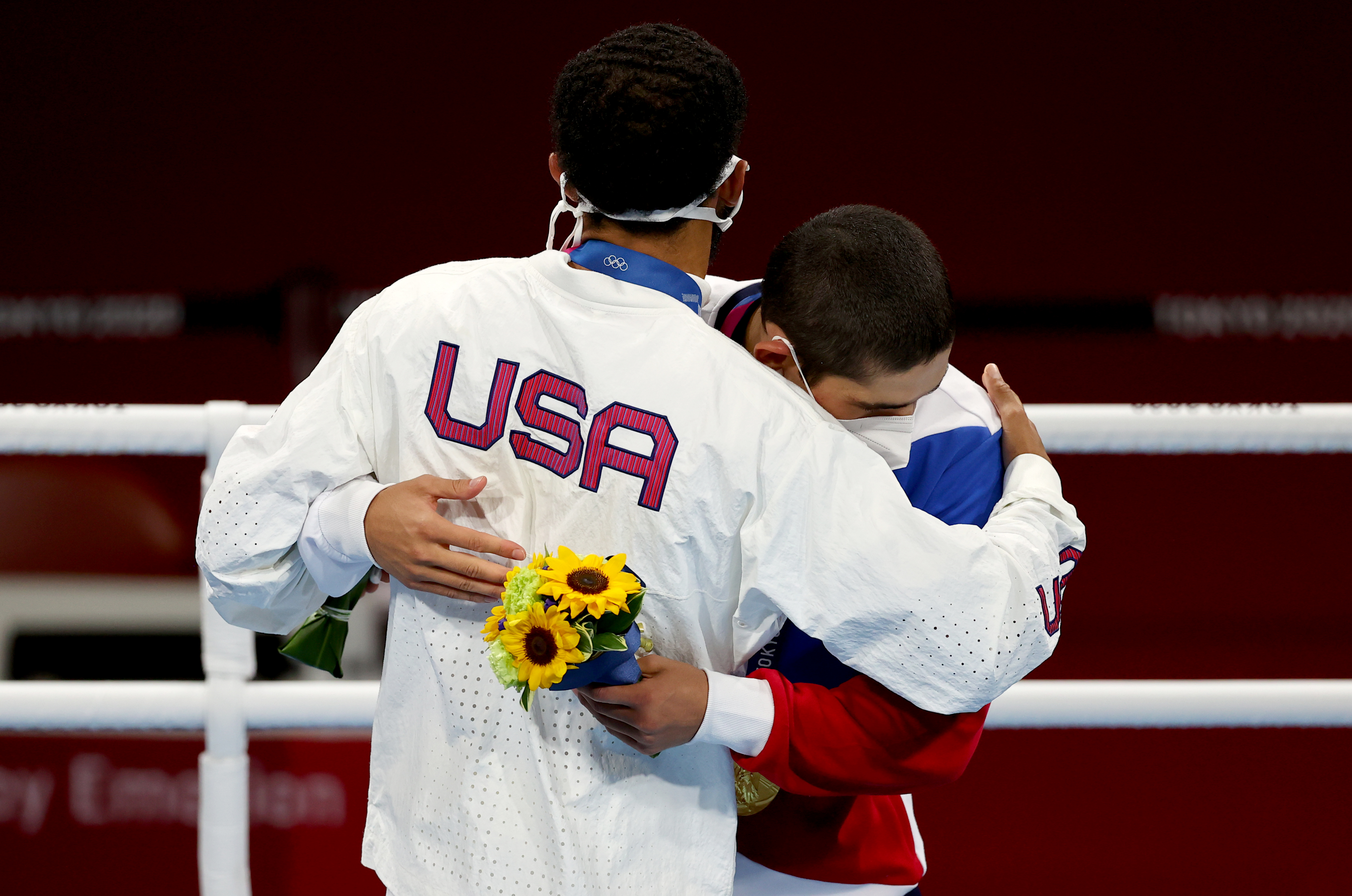 Tokyo 2020 Olympics - Boxing - Men's Featherweight - Medal Ceremony - Kokugikan Arena - Tokyo, Japan - August 5, 2021. Gold medallist Albert Batyrgaziev of the Russian Olympic Committee and Silver medallist Duke Ragan of the United States embrace during the medal ceremony REUTERS/Amr Abdallah Dalsh