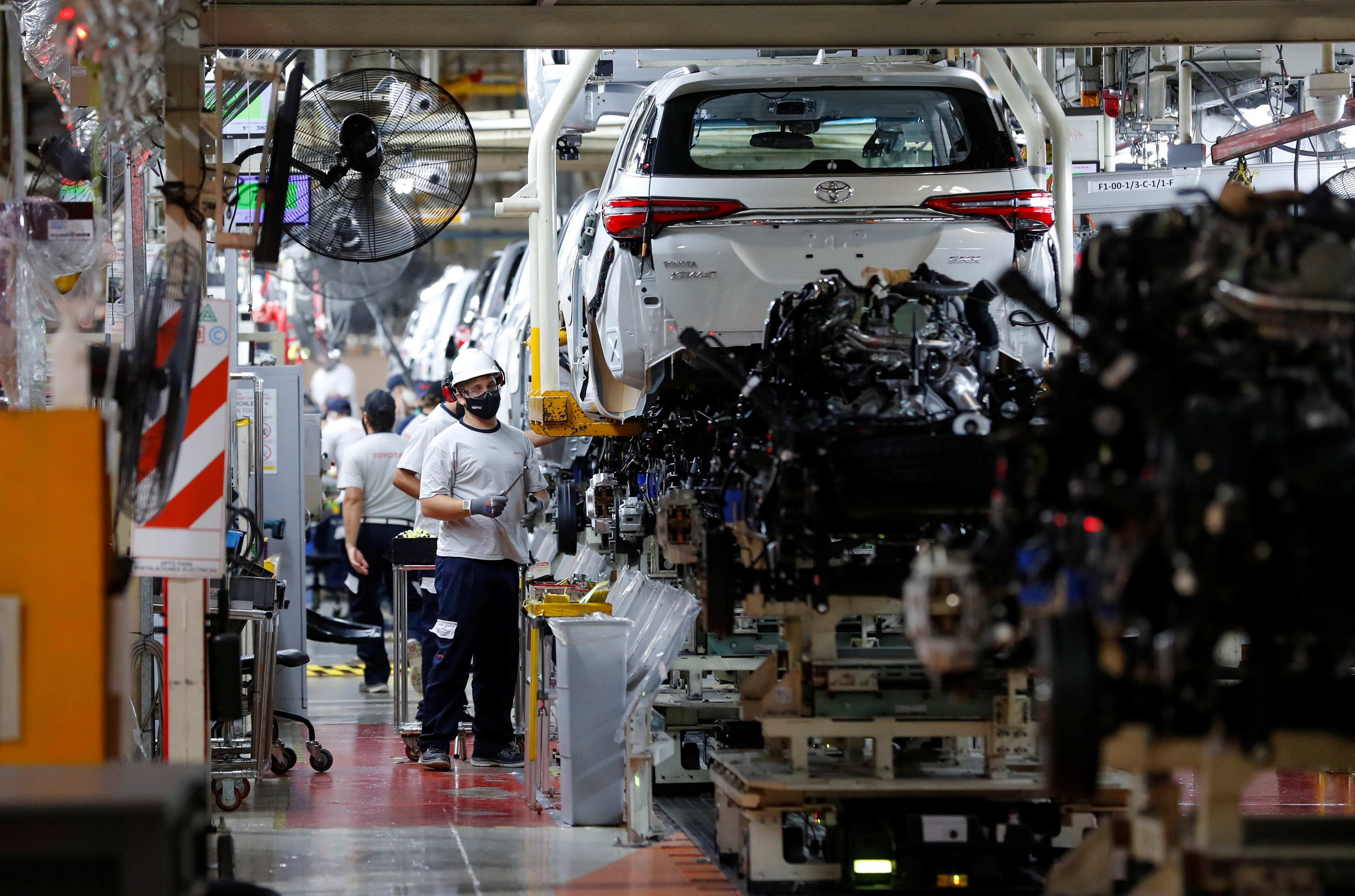 Employees work at the Toyota assembly plant in Zarate, on the outskirts of Buenos Aires, Argentina March 15, 2021. REUTERS/Agustin Marcarian